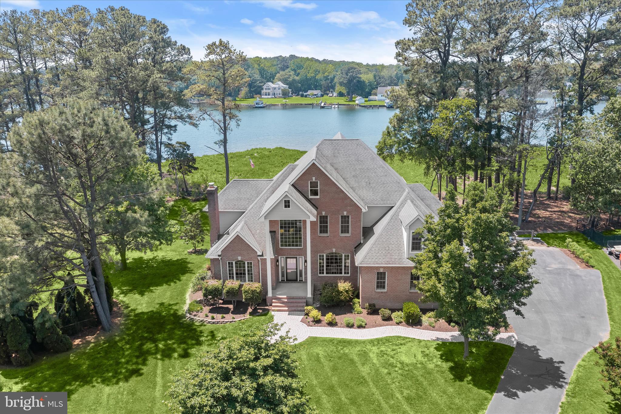 Rare Waterfront Opportunity!   

Enjoy waterfront living on the shores of Winchester Creek, at the base of the Chester River in the sought-after waterfront community of Homeport. This exceptional residence with coastal flair offers sweeping water views, refined interior updates, and resort-style living designed to embrace Maryland's Eastern Shore lifestyle.   Included with the property is Deeded Boat Slip #5, complete with both a boat lift and a PWC lift. The deeded slip is maintained by the HOA for only $600 annually, offering direct access to the water and a truly low-maintenance boating lifestyle.   

Nestled on a beautifully landscaped homesite with direct water access, two deeded slips and a private natural shoreline, the property captures the beauty of waterfront living with
peaceful views, ever-changing sunsets, and a seamless connection between indoor
and outdoor spaces. Inside, more than 4,400 square feet of light-filled living space
unfolds across three finished levels, where expansive windows frame the sparkling
waterfront setting from nearly every angle. Curated upgrades including hardwood
flooring, fresh interior paint, custom millwork and designer finishes create a relaxed
luxury aesthetic throughout the home. The welcoming foyer is flanked by a cozy living
room with fireplace and a formal dining room ideal for entertaining. Beyond, the
foyer opens into a dramatic two-story family room anchored by an upgraded
fireplace, soaring custom millwork surround and a waterside-wall of stacked windows
that showcase breathtaking water views and fill the open plan home with natural
light. Designed for everyday comfort and effortless entertaining, the gourmet kitchen
has been beautifully updated with abundant cabinetry, a contrast center island in
coastal blue with breakfast bar seating, quartz countertops, designer tile backsplash,
pendant lighting, heated floors and ss appliances that are positioned to enjoy the
waterfront backdrop at every meal. Multiple gathering spaces provide exceptional
flexibility for modern lifestyles. An upper-level flex space serves perfectly as a
reading lounge, hobby area, home office or secondary family room. The third floor
features a wet bar, beverage cooler, and full bath, ideal for movie nights with
surround-sound, game days, guest accommodations or multigenerational living. The
main-level primary suite offers a luxurious retreat with peaceful water views,
hardwood flooring, and a fully remodeled spa-inspired bath featuring Kohler fixtures,
a sunlit soaking tub, glass-enclosed shower, designer tilework and walk-in California
Closets. A second waterside ensuite bedroom on the main level also enjoys beautiful
water views and a private bath. Outside, the serpentine paver walkway leads to an
open front porch framed by two-story columns and custom coastal blue front door.
The waterfront setting is a centerpiece of daily living where the waterside elevation
includes a newly expanded dining deck, updated covered porch and grand stairs that
lead to a comfortable backyard, side brick paver patio for grilling and professional
planting areas create an outdoor retreat designed for relaxation and entertaining.

Whether enjoying morning coffee overlooking the glistening water, afternoon siestas
by the water, hosting sunset gatherings, heading out for water activities from the
deeded boat slip from Homeport’s private pier, this property offers an exceptional
opportunity to experience the very best of Eastern Shore waterfront living. Extensive
recent improvements provide both comfort and peace of mind, including dual high-
efficiency Bosch HVAC systems (2023 & 2024), a Rinnai Sensei tankless water heater,
Honeywell smart thermostats on all three levels, whole-house water treatment and
smart water management systems, updated baths with Kohler fixtures, ceiling fans,
fresh interior paint, and professionally enhanced landscaping with regrading and
privacy enhancements.