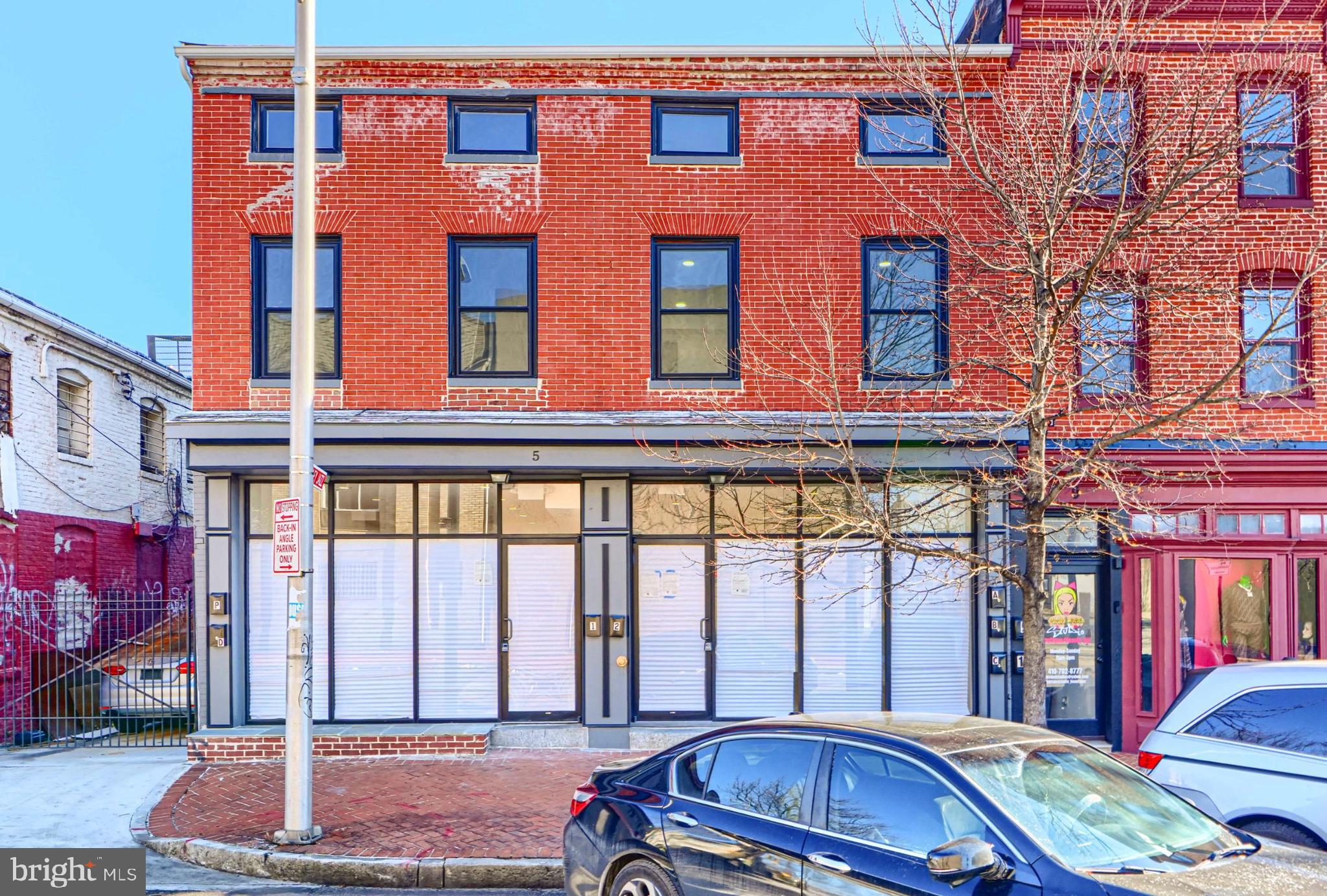 Discover a prime investment opportunity in the heart of the bustling Hollins Market business district. This updated commercial property, built in 1900, boasts a solid brick and frame construction, ensuring durability and character. The 1st floor houses two commercial units and one studio apartment. While the 2nd and 3rd floors are apartment units with 2 bedrooms (2nd floor) and one bedroom (3rd floor). The building is completely renovated with sprinkler systems, separately metered and has versatile flooring options, including vinyl, ceramic tile, and concrete, allowing for easy customization to suit your business needs. The property is located in a corner lot, which offers excellent visibility and accessibility, making it an ideal location for a variety of business ventures. The surrounding area is vibrant, with a mix of shops, restaurants, and local attractions, creating a dynamic environment that draws foot traffic and potential customers. Enjoy the stunning views of the city and street, enhancing the appeal of your business to passersby. Investing in this location not only offers immediate business potential but also positions you for long-term growth in a thriving district. The combination of a historic building and a strategic position creates a unique opportunity for savvy investors looking to capitalize on the area's ongoing development and revitalization. Seize the chance to make your mark in this vibrant community, where the potential for returns is as bright as the city views.