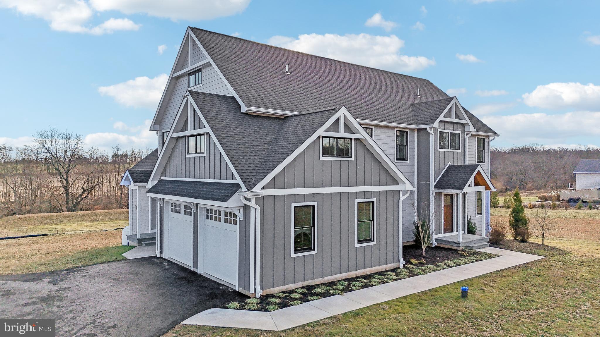 NEW CONSTRUCTION!    Welcome to this exceptional custom-built Farmhouse, situated on a picturesque 3-acre lot backing to preserved farmland in the highly desirable Central Bucks School District. Located just 1.5 miles from Peace Valley Nature Center. With a thoughtfully planned layout and an abundance of natural light, this home is perfect for both entertaining and comfortable living. Step inside to discover a grand foyer featuring stunning herringbone pattern flooring, 9FT ceilings, and an elegant staircase. To the right, a formal living area flows into a private office with double doors, creating a perfect work-from-home space. To the left, a formal dining room awaits, ideal for hosting memorable gatherings with 2 closets. At the heart of the home, you’ll find a gourmet kitchen with a spacious island for seating, a propane range with a striking hood, a convenient pot filler, and plenty of cabinet space. The cozy morning room and inviting family room, featuring vaulted ceilings and a propane fireplace, provide additional areas to relax and enjoy overlooking your private level backyard. Every room in the home is outfitted with high hat lighting, paired with a thoughtfully curated selection of stunning light fixtures that enhance the ambiance and design.

Conveniently located off the 2-car oversized garage are a mudroom, which could easily accommodate an additional washer and dryer if needed, and a powder room for easy access. The second floor boasts a luxurious primary suite with an expansive walk-in closet, dressing area, and spa-like bath featuring a soaking tub and a large traditional shower. Three additional bedrooms, each with private access to a full bathroom, provide plenty of space for family or guests, and the laundry room is also located on this level for convenience. With plenty of closet space throughout the home, storage will never be an issue. The daylight basement, complete with a large window, provides an abundance of space for storage or the opportunity to create a custom finished area.  As long as they are not kept for farming purposes, this property provides a unique opportunity for animal lovers to enjoy keeping a horse or goat as a pet, with zoning regulations requiring the housing structure to be 100 feet from property lines or the street.

This stunning home, ready for immediate move-in, also offers ample opportunity to add your own finishing touches and personalize the space to truly make it your own. Combining modern amenities, timeless design, and a tranquil setting, all within an award-winning school district, this is a one-of-a-kind property you won’t want to miss! Please view video and 3D imaging.  Property has been staged with furnishings. Move-in ready!