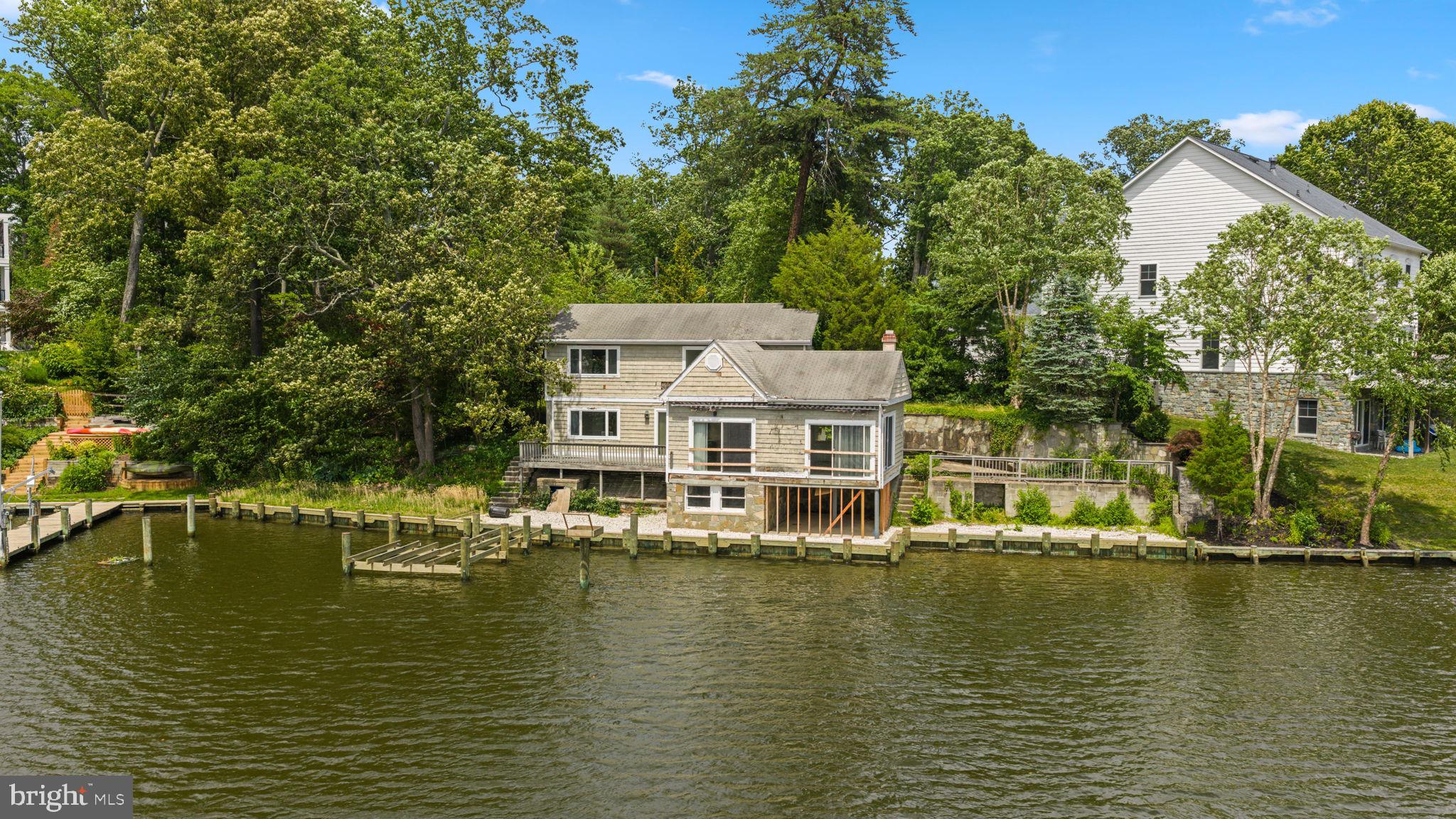 Rare opportunity to create a premier waterfront estate on the Magothy River. Situated on an exceptional waterfront lot, 353 South Drive offers endless possibilities for buyers seeking a custom waterfront lifestyle in one of Anne Arundel County's most desirable locations.

The existing home is in need of significant renovation, making this an ideal opportunity to rehab, expand, or start fresh with a new custom residence. A variance has already been obtained allowing for expansion of the current footprint, including plans for a pool and pool house. Alternatively, buyers may choose to remove the existing structure and construct a larger home positioned farther back on the lot to maximize the property's potential.

Unlike many waterfront redevelopment opportunities, several major improvements have already been completed, including a newer bulkhead and pier. Public water and sewer service further enhance the property's appeal and simplify future development plans.

Whether you're a builder, investor, or end user searching for a one-of-a-kind waterfront homesite, this property offers a unique combination of location, flexibility, and upside potential. Bring your vision and create the waterfront retreat you've always imagined.