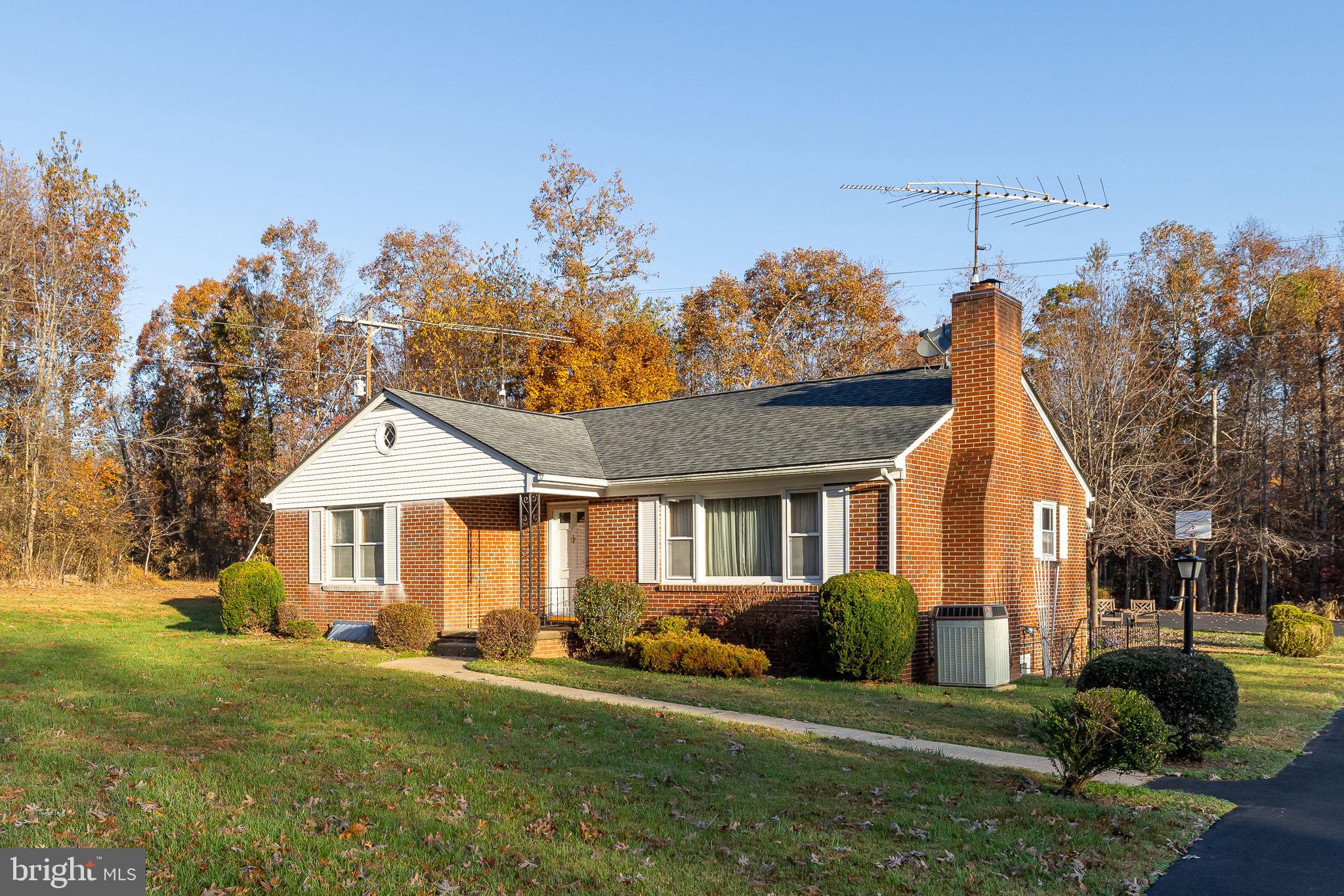 You will not want to miss this well-built all brick rambler on one acre.  This home is a quality-built home with 3 bedrooms and 1 full bathroom.  The kitchen has ample space for a kitchen table and the living room has a beautiful wood burning fireplace.  Gorgeous hard wood floors throughout the main level.  The lower level boasts a second kitchen area, gathering place and lots of extra space.  The open yard is well landscaped and perfect for family gatherings.  A large storage shed is available for all of your tools and toys!  This is a must-see property.