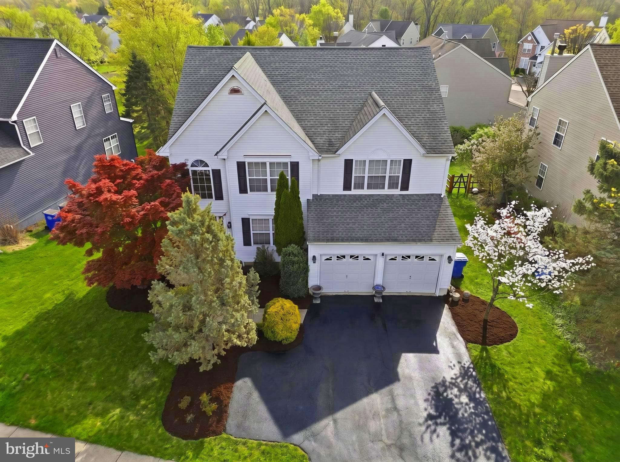 Welcome to 103 Hidden Court! With over 2,900 above grade sqft, this beautiful maintained home tucked within one of the most desirable pockets of New Hope Borough, is the one you've been waiting for! Location here is EVERYTHING! Situated just off Main Street, you are within walking distance of the heart of the borough. Boutique shopping, dining, and vibrant nightlife are all right at your fingertips! From the moment you arrive, the pride of ownership is undeniable. This is a turnkey opportunity with every detail thoughtfully handled. A grand, light-filled entrance immediately sets the tone, with soaring cathedral ceilings that span the length of the home, creating an open and impressive first impression. The unique catwalk design adds architectural interest while offering a striking vantage point that connects both sides of the home. This residence offers the perfect balance of formal and everyday living. The formal dining room is a standout, featuring beautiful custom trim work with classic shadow boxing, an elevated detail that adds depth and character. Throughout the home, you’ll appreciate the fresh, professionally executed neutral paint palette, creating a clean, cohesive look that allows any style to come to life. The eat-in kitchen features timeless shaker-style cabinetry, granite countertops, and stainless steel appliances, both functional and stylish for today’s buyer. A brand new tiered Trex deck sits off the first floor, perfect for those warm summer nights ahead. Upstairs, the primary suite is a true retreat, offering enough room for a sitting area, an oversized walk-in closet, and a beautiful bathroom complete with a new double vanity, soaking tub, and separate walk-in shower. Three additional generously sized bedrooms provide flexibility for family, guests, or home office needs. The fully finished walk-out basement expands your living space significantly, mirroring the home’s footprint and opening directly to a private backyard framed by mature trees. This home also backs to a common open area, an incredible extension of your outdoor space, and a perfect added play area. A few highlights include a two-car garage, ample storage throughout, a newer roof, and so much more. Residents also have the option to enjoy the nearby amenities of Village 2, including access to pools and community features for an additional fee, just steps away. Set within the highly regarded Solebury School District, this is a coveted location where the neighborhood itself is part of the appeal. Perched high on a hill, the community offers a picturesque setting with sidewalks connecting throughout and a thoughtful layout of quiet cul-de-sacs that enhance both privacy and charm. Outdoor enthusiasts, the Delaware Canal Towpath offers miles of scenic trails along the river, perfect for walking, biking, and taking in the beauty of Bucks County. With convenient access to major roadways, nearby regional rail in Lambertville and Doylestown, and an easy commute to Philadelphia, I-95, and New York, making everyday travel effortless while keeping you exactly where you want to be!