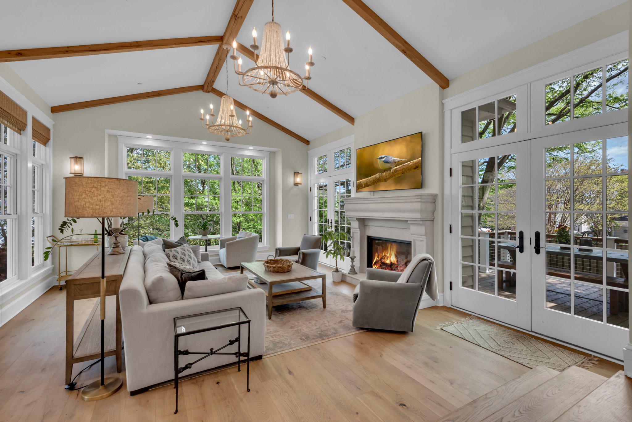 An exceptional offering in beloved Murray Hill, 4 Southgate Avenue is a stately American Four Square that was masterfully reimagined in 2021 by the current owner, in collaboration with Cumberstone Builders and acclaimed architect Jay Schwarz of Alt/Breeding/Schwarz.  Four Southgate Avenue seamlessly blends historic charm and architectural pedigree with the ease of modern living.  A classic front porch greets you, and the original front door welcomes you into a gracious foyer showcasing timeliness wainscoting bathed in natural light.  French doors reveal an elegant living room salon, enveloped in floor to ceiling custom bookcases.  A bespoke bar anchors the space, evoking an era of sophisticated entertaining beside a fireplace finished in a custom plaster surround.  The gracious dining room, perfect for large gatherings, flows effortlessly to a true gourmet kitchen.  The kitchen is impeccably appointed with a chef’s gas range, custom hood, built in refrigerator, and custom cabinetry with quartz countertops.  An island with breakfast seating provides a generous work space.  The homes original back door was thoughtfully repurposed into a charming pantry, combining character with great function.  The home retains the refinished original pine floors and wide plank oak flooring, along with craftsman paneled doors and vintage hardware.

A dramatic vaulted ceiling with reclaimed Pennsylvania barn wood beams and a striking limestone fireplace define the grand family room.  Oversized windows fill the space in natural light, and french doors open to the rear deck and yard creating seamless indoor-outdoor living.  A side entry mudroom with bench seat and storage serves as the the family drop zone, and the original side porch, also featuring vintage doors, was enclosed to provide a private home office and powder room.

The second level features a spacious landing with original paneled cupboards for linens, and four well-appointed bedrooms and two full bathrooms.  The hall bath retains it’s vintage appeal with white subway time and original bathtub, while one bedroom includes a uniquely designed en-suite bathroom.  Another bedroom opens to a charming private balcony overlooking the rear garden, and all bedrooms offer ample close space.

Privately situated on the third level, the primary suite is a cozy retreat with window seats tucked into the original dormers with winter water views.   Here you will find generous his and hers walk-in closets, and a primary bath with a large shower enclosure and pedestal tub.

A finished lower level further enhances the homes versatility and living space, offering great ceiling height and an expansive recreation room.  A full bathroom, a charming laundry room, as well as an additional room ideal for a gym or guest accommodations complete the space.  Plenty of storage is available in a large unfinished utility space. 

This entire home was renovated top to bottom in 2021, providing all new systems in a home that retains the historic charm that makes Murray Hill such a desirable community in downtown Annapolis.  A driveway easily accommodates up to 3 cars, and the rear yard is fully fenced with custom gates for added privacy. Surrounded by similar stately homes, with water access to Spa Creek steps from the front door and walkability to downtown Annapolis, this home is truly a rare find.