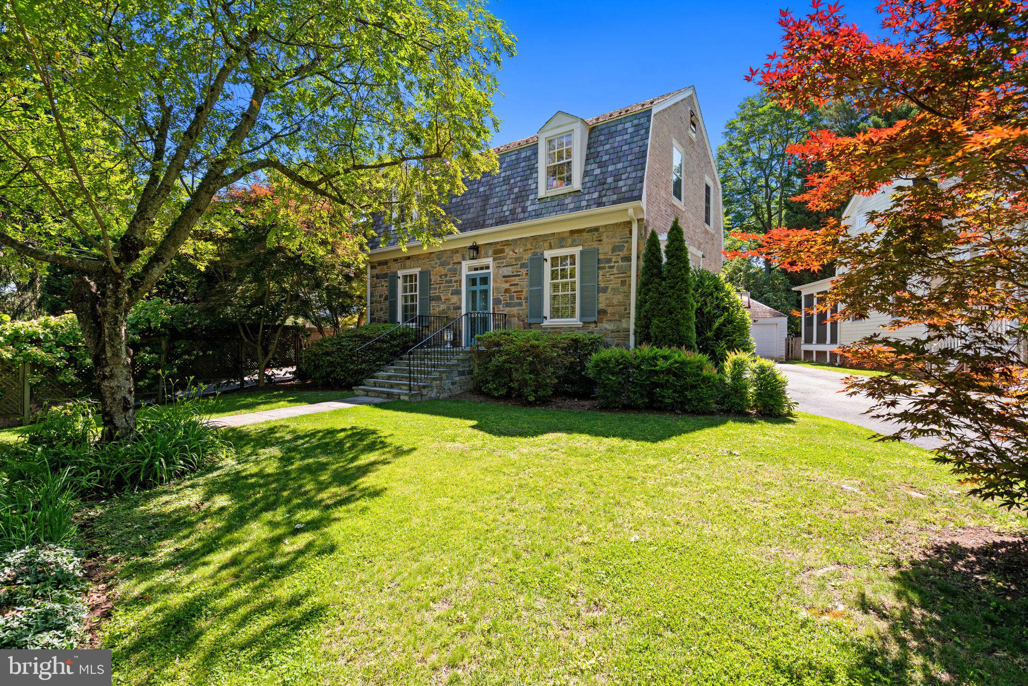 Welcome to 4809 Jamestown Road, a beautifully maintained Dutch Colonial located within Yorktown Village, part of Bethesda's beloved Westbrook Neighborhood.

This Breuninger-built, Williamsburg-inspired home features four bedrooms (upstairs), three and one-half baths over three finished levels. A timeless residence blends classic architectural character with thoughtful updates, comfortable living spaces, and an exceptional location close to everything Bethesda has to offer.

Warmth and curb appeal are unmatched here. The stone façade and mature trees set the stage. Inside, rich hardwood floors, traditional moldings, custom built-ins, and sun-filled rooms reflect the enduring appeal of the neighborhood's original homes.

A formal foyer greets guests with designer-inspired lighting and wallpaper. The living room centers around the fireplace with a traditional mantel and multiple exposures creating a warm gathering space for everyday living and entertaining. The dining room, highlighted by a beautiful bay window, provides an ideal setting for holiday gatherings and special occasions.

The updated and elegant kitchen features designer tilework, stainless steel appliances, and loads of light. It opens to the bright sunroom and directly to the rear deck and backyard, creating seamless indoor-outdoor flow. A conveniently located powder room completes the main level.

Upstairs, the spacious primary suite offers a private en suite bath and abundant natural light. Three additional bedrooms and a hall bath provide options for any homeowner.

The lower level, complete with its own private entrance, features a recreation room, cozy den, full bath, laundry area, and excellent storage space.

Outdoor living is equally inviting. The rear deck overlooks a generous backyard with ample room for dining, gardening, recreation, or future enhancements. Mature landscaping and established greenery create a peaceful backdrop rarely found so close to the city.

Even better? A detached one-car garage provides secure parking, workshop space, or additional storage, while the driveway offers convenient off-street parking.

Named one of Bethesda Magazine's "Great Neighborhoods," the "Westbrook Neighborhood" continues to delight residents decade after decade with its Fourth of July and Halloween parades, block parties, and strong sense of community. Few neighborhoods offer such a compelling blend of charm, convenience, and connectivity. Residents enjoy easy access to neighborhood favorites including Millie's, Wagshal's, Pizzeria Paradiso, Compass Coffee, Bluestone Lane, Crate & Barrel, and the Spring Valley Shopping Center. The Capital Crescent Trail, neighborhood parks, Friendship Heights Metro, Whole Foods, Amazon Fresh, downtown Bethesda, and downtown Washington, DC are all just moments away.

Served by Westbrook Elementary, Westland Middle School, and Bethesda-Chevy Chase High School, and in bounds for the highly sought-after Little Falls Swimming Club, 4809 Jamestown Road presents a rare opportunity to enjoy the very best of Bethesda living in one of its most cherished communities. Classic, comfortable, and exceptionally well located, this is a home to enjoy for years to come.

Some photos are virtually staged. Square footage is estimated and should not be used for valuation.