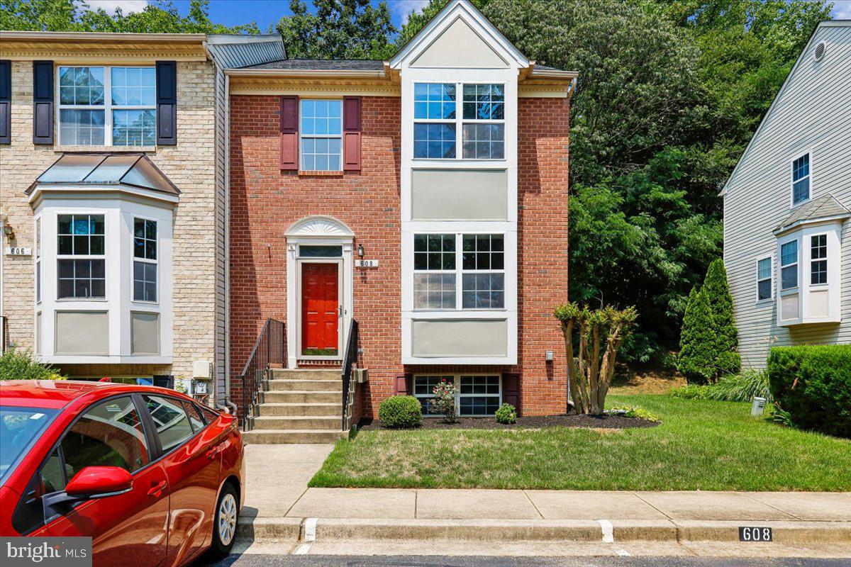 Welcome to this beautifully maintained 2,100-square-foot, 4-bedroom, 3.5-bath end-unit townhome in the highly desirable Falcon Crest community of Arnold. Combining thoughtful updates, exceptional outdoor living, and a prime location within the Broadneck School District, this move-in-ready home offers the perfect blend of comfort, style, and convenience.

One of the home's standout features is its rare oversized deck—a unique offering within the community. Overlooking a peaceful wooded backdrop, it provides multiple outdoor living spaces perfect for entertaining, grilling, or simply enjoying your morning coffee while surrounded by nature.

Inside, the abundance of natural light highlights the spacious open-concept floor plan. The beautifully updated kitchen features granite countertops, black stainless steel appliances, newly refinished hardwood flooring, and generous workspace, seamlessly flowing into the inviting living room with a cozy gas fireplace.

The main level showcases beautiful bamboo flooring, while hardwood floors continue throughout the upper level, creating warmth and timeless appeal. Upstairs, the spacious primary suite and additional bedrooms provide comfortable accommodations for family and guests.

The finished walk-out lower level expands the home's versatility with a large recreation room, a fourth bedroom, and a full bathroom—ideal for guests, multi-generational living, a private home office, or fitness space.

Additional upgrades include a new roof (2019), HVAC (2015), Nest Smart Thermostat, dedicated EV charging port, and two assigned parking spaces, offering modern convenience and peace of mind.

Beyond the home, enjoy an exceptional lifestyle with nearby Arnold Park, Broadneck Park, Bay Hills Park, Spriggs Farm Park, the Baltimore-Annapolis Trail, and Forked Creek Trails. Spend weekends boating from nearby marinas, golfing at Bay Hills Golf Club, relaxing at Sandy Point State Park, or dining at local favorites just minutes away. Historic Downtown Annapolis, BWI Airport, Baltimore, and Washington, D.C. are all within an easy commute.

This is a rare opportunity to own a beautifully updated end-unit townhome with premium outdoor living, modern upgrades, and an unbeatable Arnold location.