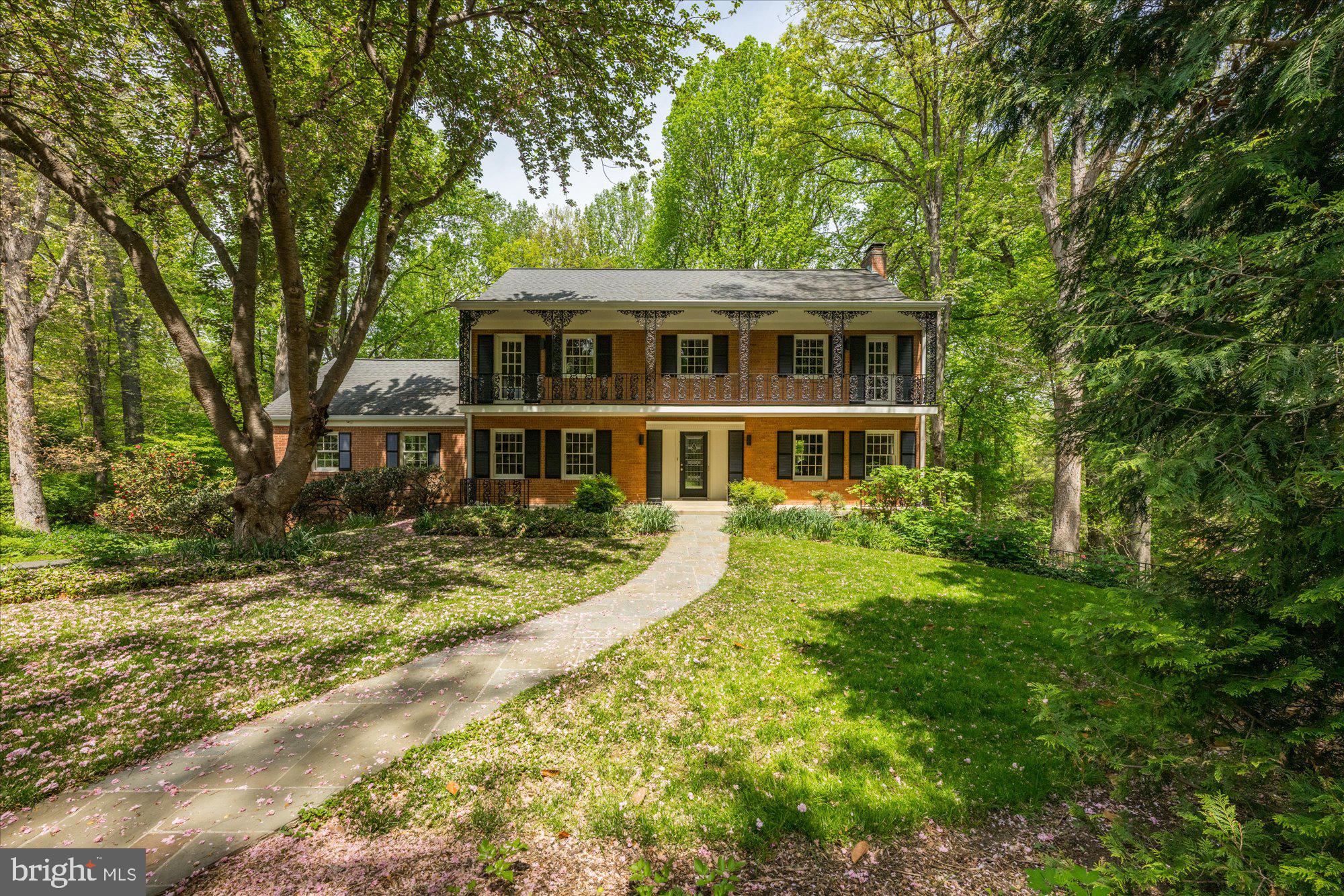 If you’re drawn to the timeless appeal of Carderock Springs and value living in the top-rated Whitman school cluster, don’t miss this rare opportunity. Nestled on a serene 3/4 acre gardener's paradise, this extraordinary   New Orleans-style all brick colonial  offers over 4,500 SF of gracious living space, plus a massive walk-up attic brimming with potential.   With a lush setting and mature trees, this home is a peaceful retreat with access to the close-knit Carderock community and its coveted amenities. A winding stone path  bordered by perennial gardens leads to the welcoming front porch, setting the stage for what lies within.  Distinctive architectural elements - including a signature second story balcony with intricate wrought iron railings- capture the spirit of New Orleans and southern charm.  Inside, the foyer opens to a private library and a dramatic, light-filled family room addition with a wall of windows, soaring ceilings, and built-in bookcases. The main level also features a formal living room with a wood-burning fireplace, a formal dining room, and a bright, thoughtfully designed Chef's kitchen with a gas cooktop, island, pantry, ample cabinetry, and picture perfect views of the backyard.  Upstairs are four spacious bedrooms including a spacious Primary Suite with a Sitting area, a recently renovated Primary Bath with a soaking tub, stall shower and double vanities. 
Three other well proportioned bedrooms share the renovated hall full bathroom.  The expansive attic with high ceilings offers exciting potential for further square footage or simply use it for easy access storage. The newly carpeted, fully finished daylight walk-out lower level boasts 9.5-foot ceilings, a Mendota gas fireplace, a third full bath, an au pair suite or 2nd home office, laundry, and abundant storage.  Additional features include an oversized two-car garage with a level 2 EV charger, an invisible fence, and home theatre & sound system.  Ask the listing agent about potential hook-up to public utilities.  Enjoy membership in the Carderock Springs Association with annual events and access to the Swim and Tennis Club offering pickleball, tennis, swim and dive teams, and summer socials. Located in the desirable Carderock/Pyle/Whitman school district and minutes from private schools like Norwood and Holton-Arms, this home also offers quick access to the Beltway, I-495, leading to downtown DC or over to Tyson's Corner VA or north to the I-270, BioMed Corridor.  Commuting options also include public transportation via the T-2 Metro bus heading to Friendship Heights Metro. Nearby shopping and dining options  include the Bethesda Co-op, neighborhood restaurants on MacArthur Blvd, Potomac Village or down River Road to the shops at Westbard Square.   You will LOVE this location especially the ease getting to local airports - Reagan National and Dulles International.  If you enjoy hiking, you will undoubtedly enjoy the access to the popular Cabin John Stream Valley Trails. Escape into nature when you wish. This updated, well maintained home offers both sophistication and comfort in one of Bethesda's most vibrant, picturesque neighborhoods.  Make it yours today and enjoy all the community fun Carderock has to offer!