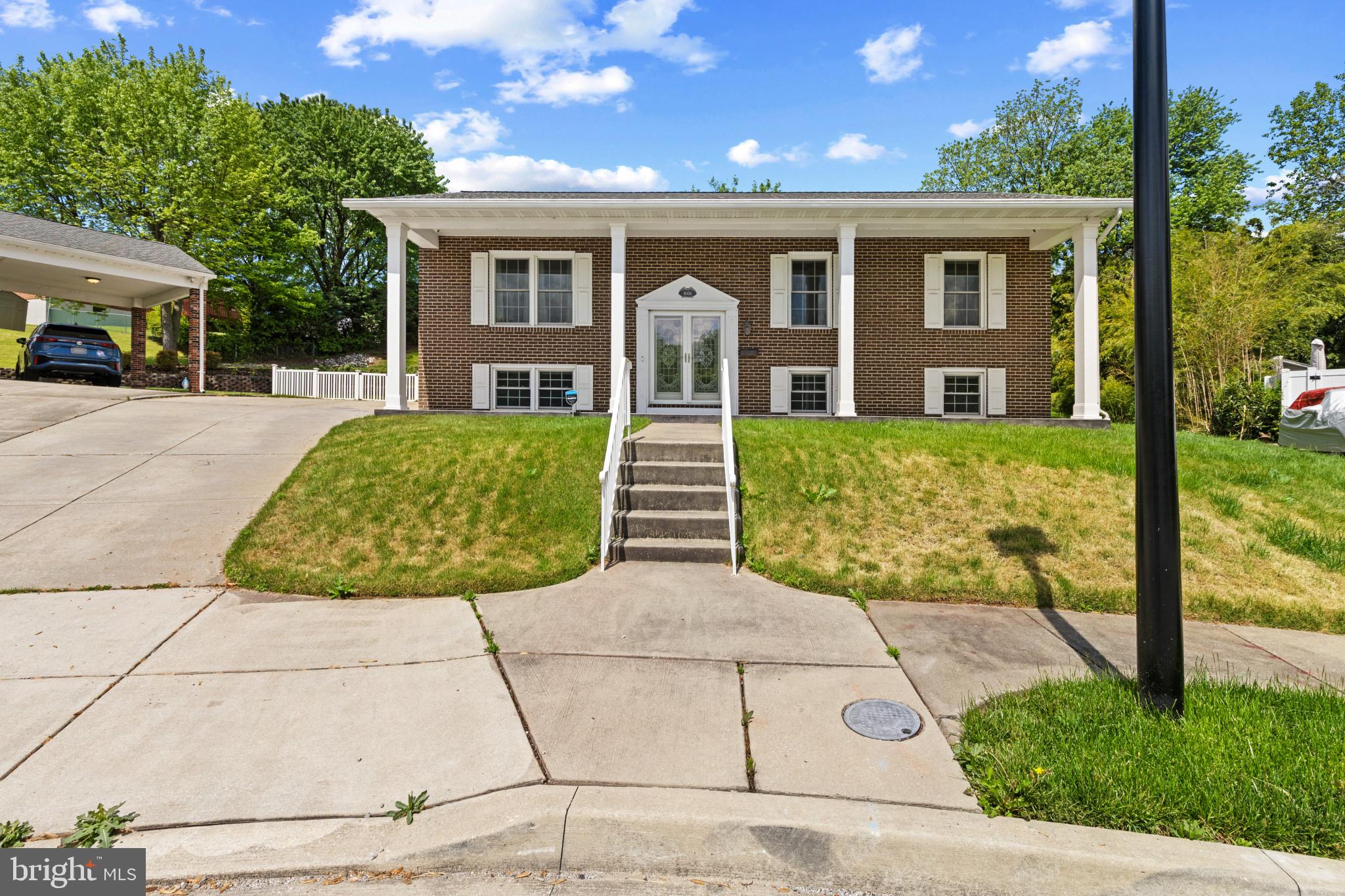 Welcome to 8006 Woodhaven Court. This Beautifully maintained home features four bedrooms, three bathrooms, elegant hardwood floors, and plenty of natural light. The property offers a sitting room and living room on the upper level, separated by a kitchen and dining room. The upper level boasts three bedrooms and two bathrooms, as well as access to the deck on the side of the home. The lower level features a family room, bedroom, bathroom, and storage area. The property is filled with outdoor space including a front porch, side deck, rear deck, rear porch, and yard.