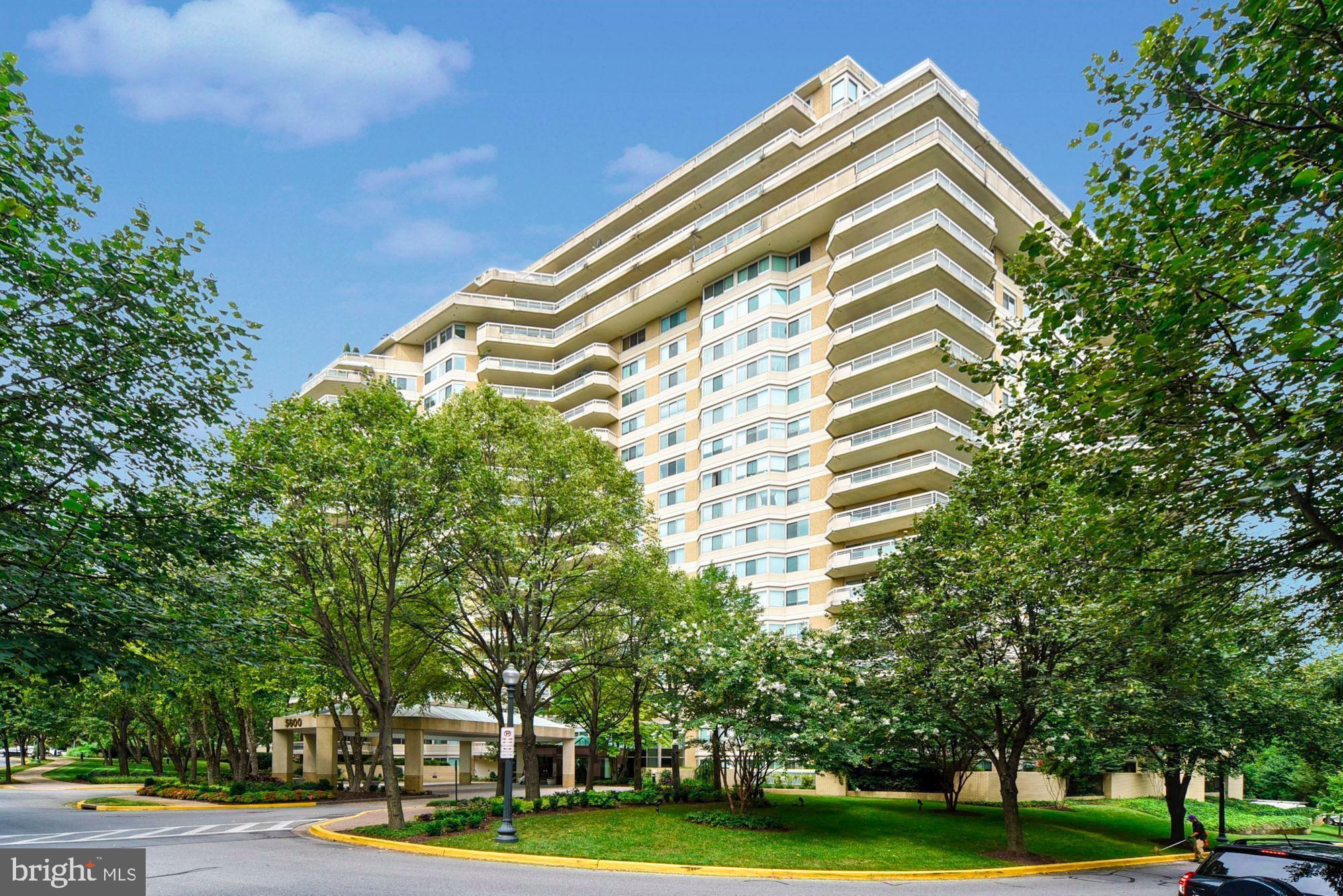 Large corner 2BR+Den/2.5BA luxury residence at the Somerset.  Features an elegant entryway, spacious light-filled living room with access to balcony, converted den wall removed to create extra open concept living, formal dining room for entertaining, hardwood floors and new carpet in bedrooms, laundry room, and spacious bedrooms with tons of closet space (master with two walk-in closest, wall of built-ins and dressing area) Dining room offers tree-top views and also has room for large buffet table and includes built-in shelving. Includes 2 secure garage parking space. Enjoy resort-style living at the Somerset: this is a gated community with 24 hr security, valet, concierge, indoor and outdoor pools, tennis and racquetball courts, exercise studio, state of the art gym, sauna and steam room, and luscious landscaped common grounds.  Close to Metro, fine dining options, and high-end shopping in nearby Friendship Heights and Chevy Chase.