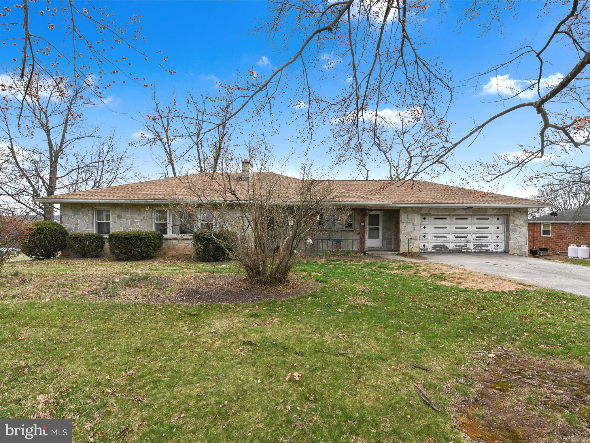 This is a can't miss opportunity.  This charming fieldstone rancher boasts a picturesque rural backyard view and sits on a sprawling acre of land. With 4 spacious bedrooms and 2 baths, there's plenty of room for family and guests. The fully finished basement provides additional living space and the warmth of two inviting stone fireplaces makes it perfect for cozy evenings. Enjoy the convenience of two garages for your vehicles and hobbies. Plus, you're just minutes away from shopping, dining, and recreation. This home is a must see.