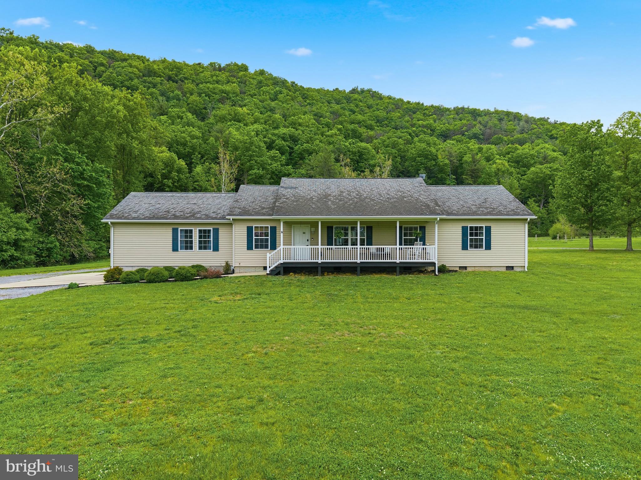 Rare opportunity to own a versatile horse property on 12.53 scenic acres in Luray. This spacious 5‑bedroom, 2‑bath home offers a flexible layout with a welcoming foyer well‑suited for office or dining use, along with a cozy living room ideal for gathering and relaxing. The home includes an existing flue, and a wood stove will convey with the property, offering the option for future installation. The updated kitchen features white cabinetry, butcher block countertops, pantry, and utility room. Recent improvements include a kitchen remodel within the last five years, new bathroom countertops, and new laminate flooring throughout most of the home. The primary suite features built‑in storage, a walk‑in closet, and an ensuite bath with a spacious soaking tub and a separate stand‑up shower. The home also offers spacious secondary bedrooms, multiple closets, attic storage, and a large guest bath. The land includes approximately 8 cleared acres and 4 wooded acres, highlighted by Dry Run Creek and a private pond. Equestrian amenities include a custom 48x60 barn with water and electric, multiple stalls, tack room, hay loft, chicken coop with fenced yard, an 80x150 level riding arena, and a site prepped for a round pen. Three 12x20 sheds (two built in 2021) include one shed with electric service and lighting and another prewired for future power. A welcoming front porch and rear deck complete this well‑rounded country retreat.