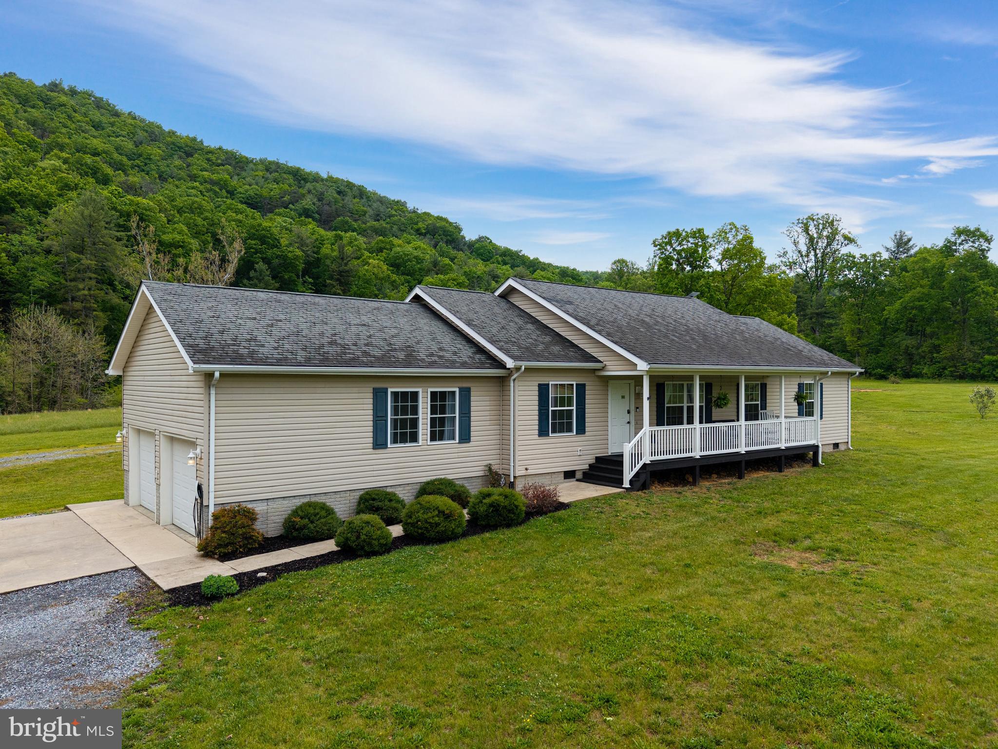 Rare opportunity to own a versatile horse property on 12.53 scenic acres in Luray. This spacious 5‑bedroom, 2‑bath home offers a flexible layout with a welcoming foyer well‑suited for office or dining use, along with a cozy living room ideal for gathering and relaxing. The home includes an existing flue, and a wood stove will convey with the property, offering the option for future installation. The updated kitchen features white cabinetry, butcher block countertops, pantry, and utility room. Recent improvements include a kitchen remodel within the last five years, new bathroom countertops, and new laminate flooring throughout most of the home. The primary suite features built‑in storage, a walk‑in closet, and an ensuite bath with a spacious soaking tub and a separate stand‑up shower. The home also offers spacious secondary bedrooms, multiple closets, attic storage, and a large guest bath. The land includes approximately 8 cleared acres and 4 wooded acres, highlighted by Dry Run Creek and a private pond. Equestrian amenities include a custom 48x60 barn with water and electric, multiple stalls, tack room, hay loft, chicken coop with fenced yard, an 80x150 level riding arena, and a site prepped for a round pen. Three 12x20 sheds (two built in 2021) include one shed with electric service and lighting and another prewired for future power. A welcoming front porch and rear deck complete this well‑rounded country retreat.