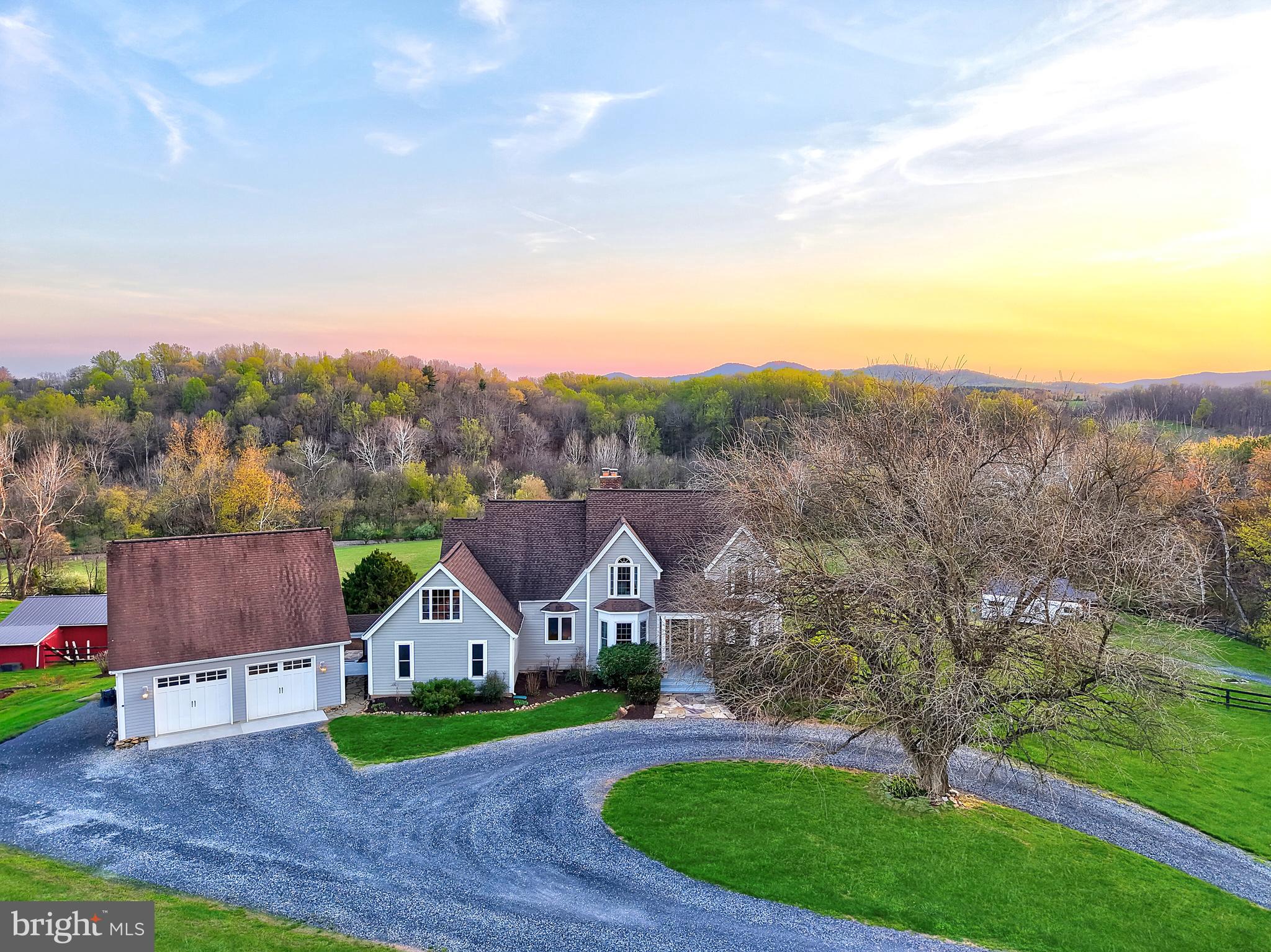 2nd Chance Opportunity!  Welcome to an extraordinary private estate set on over 25 acres of scenic countryside, where refined living meets the beauty of open farmland. A picturesque, tree-lined drive and gravel approach create a grand sense of arrival, offering both privacy and timeless elegance.


Inside, a stunning foyer welcomes you with rich wood flooring, setting the stage for the sophisticated interiors that follow. Designed with both luxury and comfort in mind, the home offers expansive living spaces ideal for entertaining and everyday living alike.


The kitchen features stainless steel appliances, granite countertops and wood cabinetry, with windows that highlight the plush landscape, perfect for gathering and hosting with ease.


Thoughtfully designed spaces flow seamlessly throughout the home, including a dedicated media room—perfect for cinematic experiences in the comfort of your own residence.


Each bedroom serves as a private sanctuary, enhanced by distinctive features such as cozy fireplaces, serene balconies, and spacious walk-in closets, delivering a true retreat-like experience. The owner's suite has a custom California Closet System in the oversized closet.


The fully finished basement introduces a private, self-contained living area complete with its own kitchen and laundry room, along with custom flagstone flooring sourced from the property itself. and a steam shower. This versatile space is ideal for extended family, guests, or potential income-producing opportunities, all while maintaining a high level of comfort and privacy.


Step outside to discover resort-style living at its finest. An expansive deck overlooks the beautifully maintained grounds, while the recently serviced pool and charming gazebo provide the perfect backdrop for elegant outdoor entertaining or quiet relaxation.


Additional amenities include a detached two-car garage and a state-of-the-art 25KW in-ground solar system, valued at approximately $100,000 and fully conveying with the property—offering both sustainability and impressively low electric costs.

With over 25 acres of versatile farmland, this estate presents a rare opportunity to embrace a lifestyle of luxury, privacy, and possibility—whether for equestrian pursuits, agriculture, or simply enjoying the tranquility of your own expansive retreat.

This is more than a home—it is a legacy property.