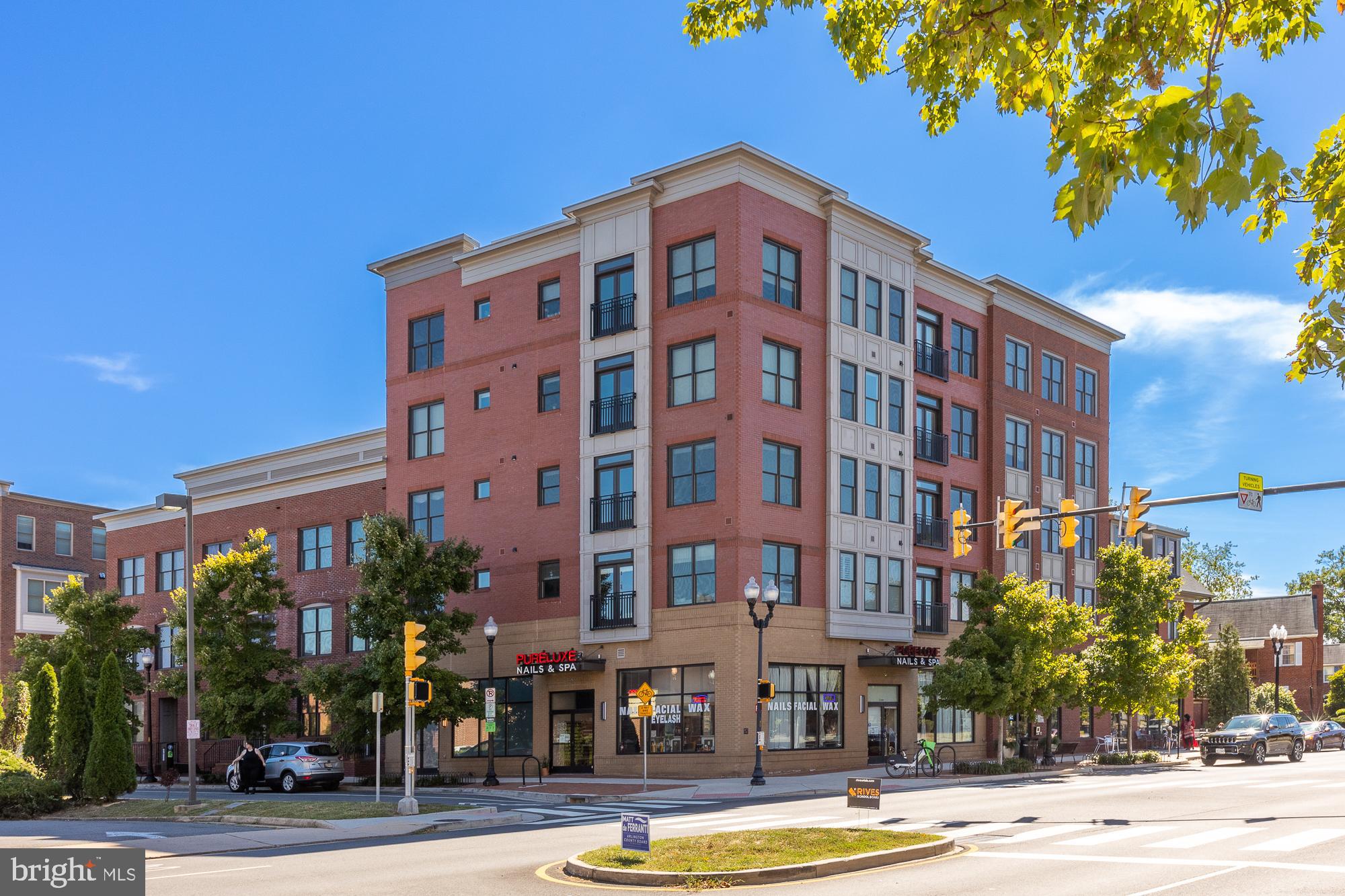 Welcome home to this luxury 2 bed 2 bath condo at Columbia Place. Built in 2015 by Evergreene Homes, you will be delighted with the extensive upgrades and high-end finishes throughout this spacious 1,290 square foot condo. Features include 9 foot ceilings, quartz countertops, WOLF induction range, stainless steel appliances, hardwood floors, custom top-down/bottom-up window treatments and designer light fixtures.

The floor plan features an open concept living/kitchen/dining area with courtyard and country club views plus a dry bar with custom cabinetry and dual temperature-zone wine fridge. The primary suite has custom-made doors to maximize space and a large walk-in closet with premier quality built-ins. The ensuite primary bathroom features a towel warmer, dual sinks and a separate soaking tub and shower with upgraded glass enclosure. The second bedroom has direct entry to the second full bath which also features a dual sink vanity. Upgraded LG front-loading washer/dryer in-unit. Assigned covered parking. This boutique building features a secure entry, elevator, bike storage, and a shared patio/grill area.

Incredible location just 4 miles from the National Mall, 4 minutes to the Pentagon, 7 minutes to National Landing and Crystal City. Walk to Giant Grocery, Walgreens, and many great restaurants and cafes including Idido's Coffee, Lost Dog Cafe, Bangkok 54, Arlington Cinema and Drafthouse and so much more! Don't miss the Columbia Pike Farmers Market each Sunday, located just steps away at Pike Park. Bus stop nearby and quick access to bike lanes and trails. Walk-score of 95! Pet friendly building (limit 2 pets). Condo fee includes water and sewer. Wired for Verizon FIOS.