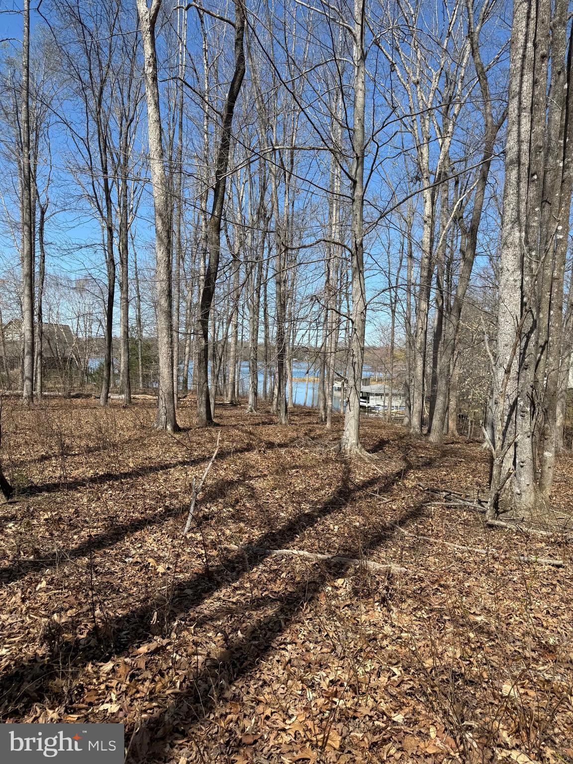 Premium lake access lot in Noah's Landing Subdivision, located on the Private Side of Lake Anna, and is very close to the lake, with seasonal waterviews.  Lot has a covered boat slip #17 with a lift in the Common Area that conveys.  Noah's Landing offers many amenities to property owners, including bike routes, beach, picnic areas, basketball and tennis courts, boat ramp, and more!
