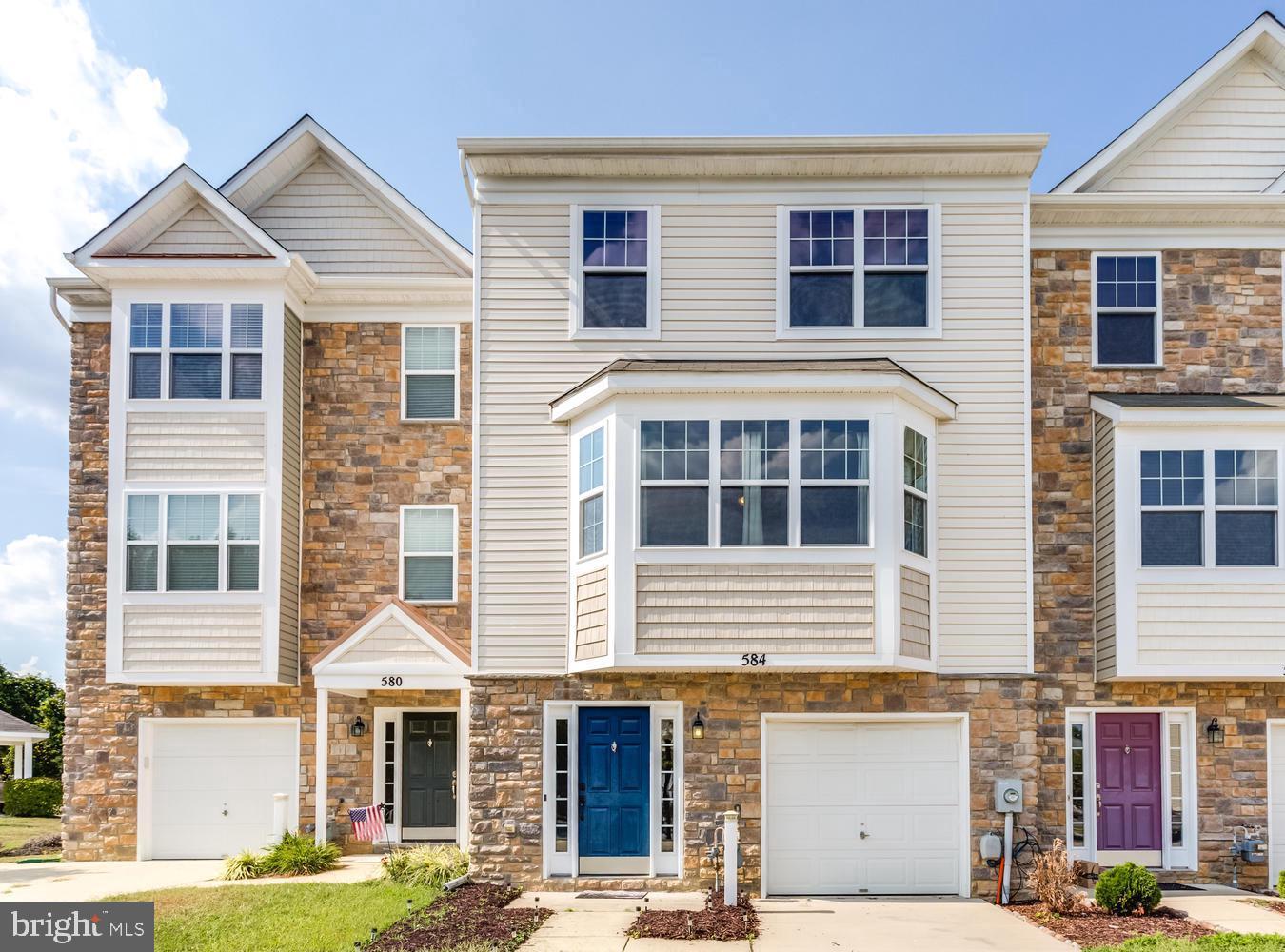 JUST REDUCED! 3 bedrooms, 2.5 bathrooms available for sale in Calvert County's Oak Tree Landing town-home neighborhood. Don't have time to build, choose to live at 584 Burr Oak Court.   All bedrooms are on the upper level; Owner's suite has over sized bathtub, separate shower and double closets. The main level features  kitchen with granite counter tops, island, plenty of cabinet space, half bath, spacious living room, and dining area that leads to the deck, perfect for entertainment. The entry way is located on the lower level, with  access through the foyer to the garage and basement. The basement is roughed for 1 bathroom, bedroom, laundry room and more flexible spaces. This is a commuter's dream, steps away from Calvert's Park N Ride and minutes away from convenient shops, eateries and movies. Strategically placed at the half way mark between two bases, Joint Base Andrews and Patuxent.  Take a tour, stay for a while, fall in love and make an offer.