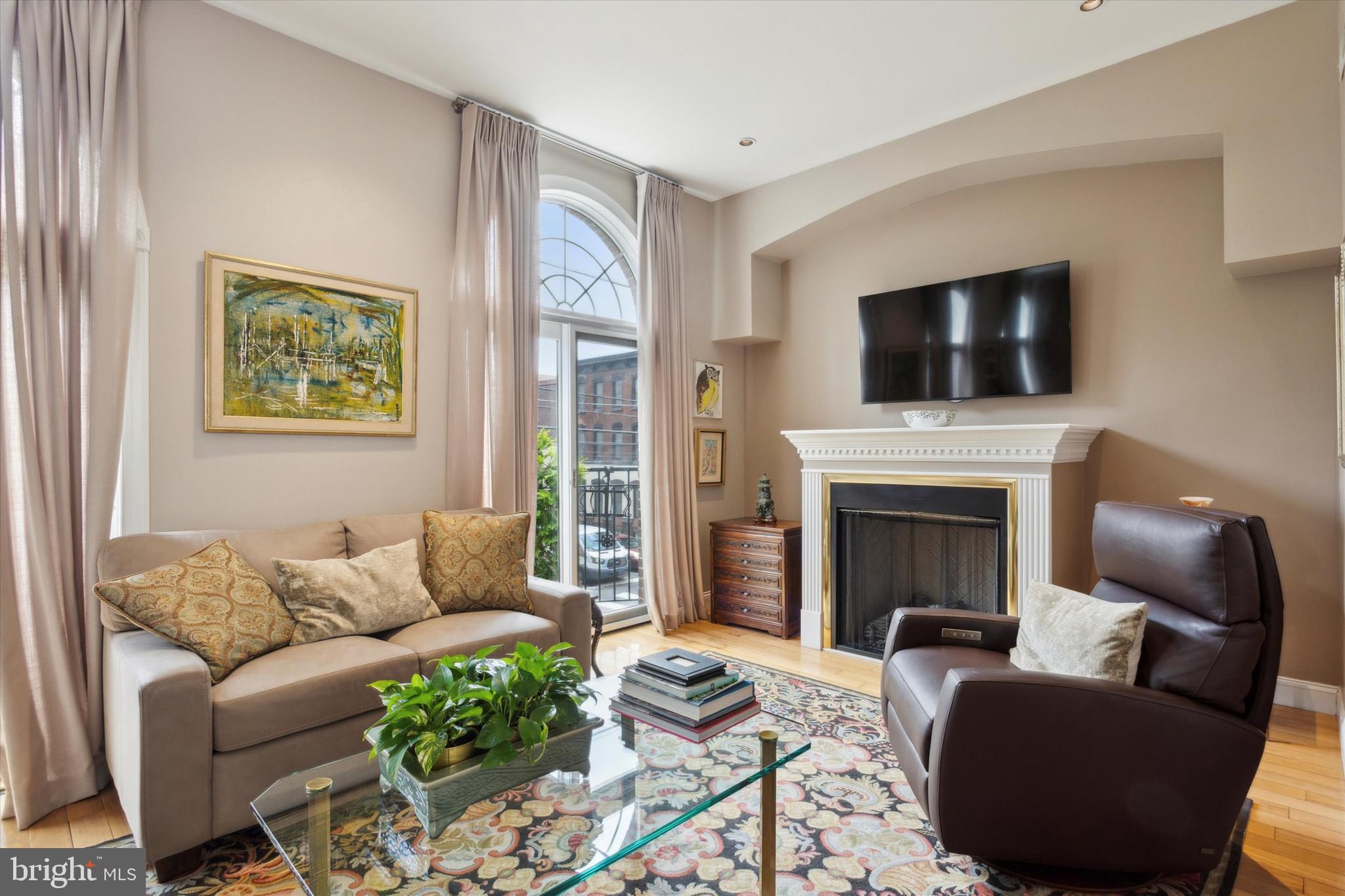 Welcome to 732-734 S 15th St! Stunning 4 bedroom 3.5 bath luxury residence just a few minutes walk from Rittenhouse Square. Unusually wide (29' 7") townhome with full size TWO car heated and insulated garage! Three separate Juliette balconies along with a magnificent roof deck with panoramic views of the city skyline. The first floor enclosed outdoor space features a lovely backyard deck and patio with a mature irrigated garden. Spectacular living/dining/kitchen space comprising the entire second floor. The gourmet kitchen is replete with tons of custom cabinets, high-end Viking appliances and plenty of granite counter space. True hardwood floors throughout. En Suite primary bedroom with bath featuring whirlpool tub, frameless glass shower enclosure, granite countertops and full wall of closets!
Finished basement that is hardwired for surround sound and can be used as the entertainment center, offices, or workout room. Fully wired for whole-house sound and security systems. Located just a short walk to Rittenhouse Square. Walker's Paradise rating of 97/100. The perfect blend of modern conveniences and classic design. NOTE: the large spiral staircase leads to the roof deck.