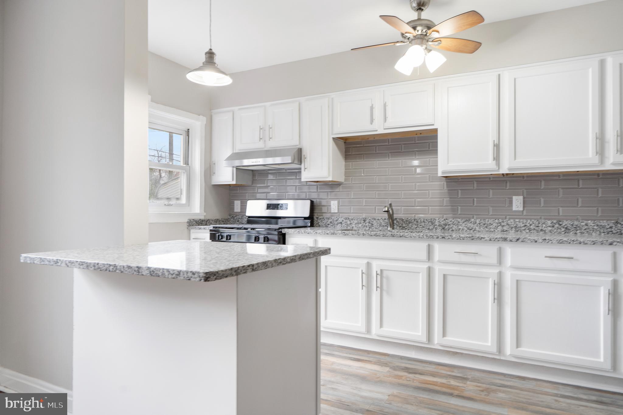 Beautifully updated turnkey home that is ready and perfect for homeowners and investors alike.  New kitchen, custom cabinets, granite counters, Stainless Steel appliances, beautifully refinished hardwoods and fully renovated lower level.  Fenced in rear yard could be converted for off street parking!
