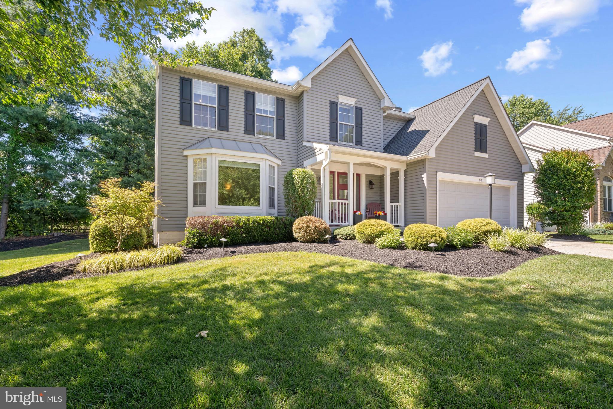 Beautifully maintained Colonial residence offering 4 bedrooms, 2 full bathrooms, 1 half bathroom, and 2,332 finished square feet on a picturesque homesite in sought-after Timber Chase. // Exceptional curb appeal begins with lush landscaping, a private driveway, a 2-car attached garage, and a charming covered front porch. Inside, gleaming hardwood floors span the traditional main level, where a welcoming foyer opens to a sun-filled formal living room accented by a bay window and continues seamlessly into the formal dining room. // The thoughtfully updated eat-in kitchen (2019) combines style and functionality with quartz countertops, a classic subway tile backsplash, stainless steel appliances, including a refrigerator replaced in 2024, a peninsula breakfast bar, and a bright breakfast area with access to the screened porch. Open to the kitchen, the spacious family room is anchored by a gas fireplace updated in 2026, creating a warm and inviting space for everyday living and entertaining. A convenient powder room completes the main level. // Upstairs, the expansive owner's suite serves as a private retreat, featuring vaulted ceilings, a walk-in closet, and a beautifully updated ensuite bath (2024) with a dual-sink vanity, corner soaking tub, separate shower, and private water closet. Three additional bedrooms, a full bathroom updated in 2022, and a conveniently located laundry room with a washer and dryer replaced in 2018, complete the upper level. // The fully finished walk-out lower level provides exceptional flexibility, offering abundant space for a recreation room, media area, game room, fitness space, or additional lounge area, along with a dedicated storage room. // Outdoor living is equally impressive. A screened porch with vaulted ceilings and a ceiling fan overlooks the backyard and steps down to a patio featuring a built-in fire pit and retaining wall. Backing to mature trees, the private rear yard provides a peaceful natural backdrop for relaxing, entertaining, and enjoying the outdoors. // Major improvements include the roof and HVAC system replaced in 2020. Additional highlights include an Action Integrated security alarm system inspection completed in 2026.