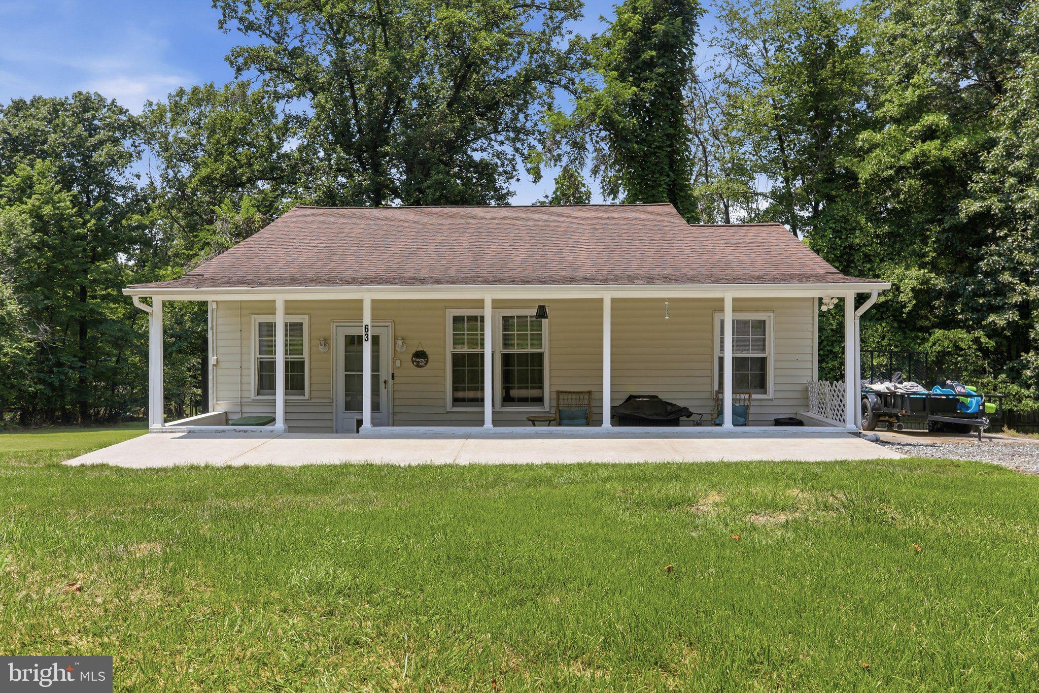 Welcome to this well-maintained ranch home in Blue Ridge Acres, offering comfort, functionality, and easy everyday living.
Situated on a peaceful lot, this 3-bedroom, 1-bath home features 1,264 square feet of thoughtfully designed space. Inside, you’ll find a practical layout with main-level laundry and a functional kitchen equipped with an electric range, dishwasher, and refrigerator—ready for daily living or your personal updates. A side deck provides a convenient outdoor space for a grill and a small seating area—perfect for enjoying your morning coffee or unwinding in the evening. The property also includes two storage sheds, offering plenty of room for tools, lawn equipment, and seasonal storage. Built in 1960 and maintained in solid condition, this home presents an excellent opportunity for buyers seeking move-in ready space with the ability to add value over time. Located in the established Blue Ridge Acres community, you’ll enjoy a quiet neighborhood setting with convenient access to nearby parks, schools, and everyday amenities. Whether you’re a first-time buyer, downsizing, or looking for a smart investment, this property offers comfort, potential, and a setting you’ll appreciate.