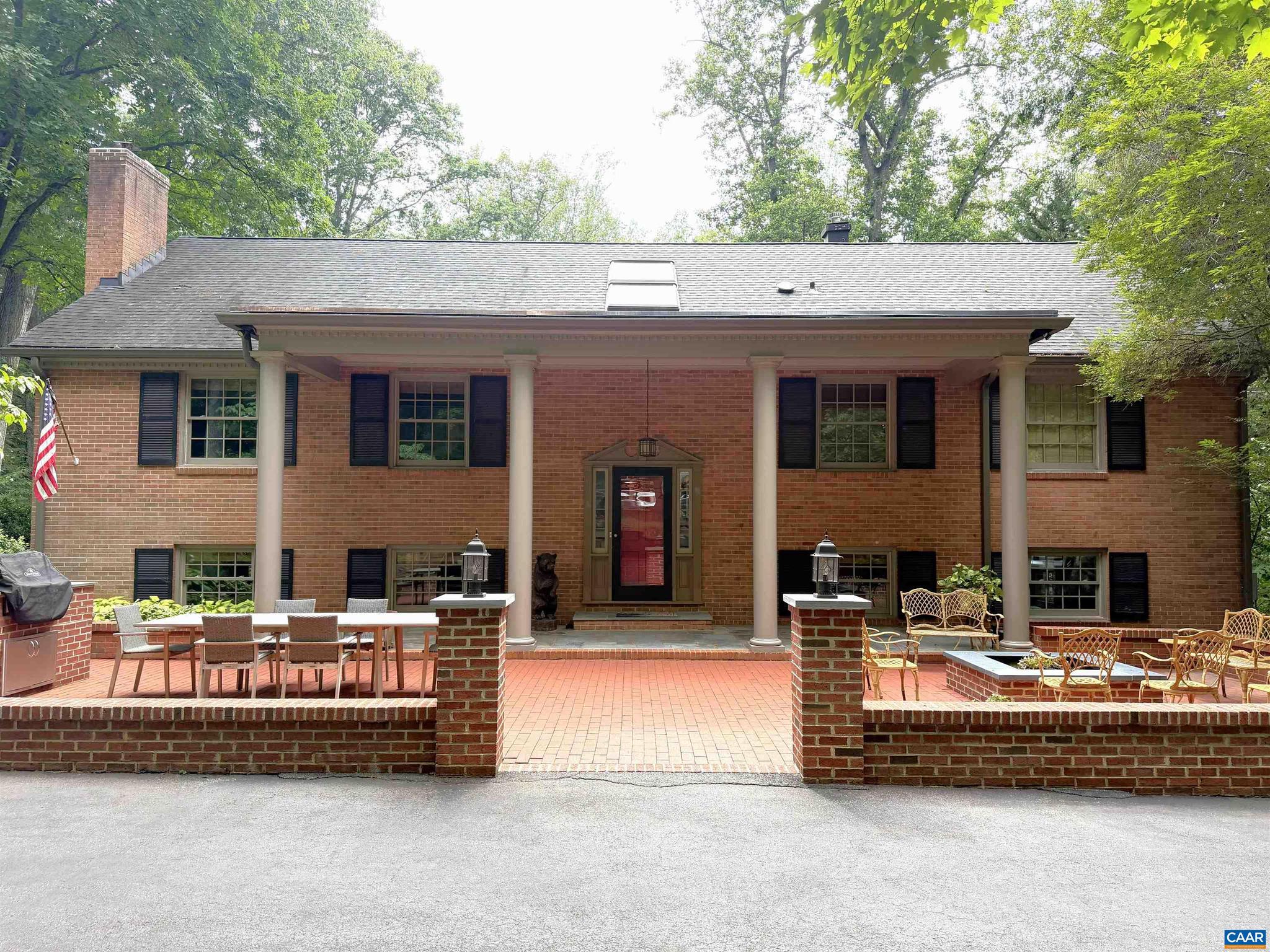 Beautifully maintained all-brick split-foyer home on one of the finest 1.5-acre lots in sought-after Flordon. This beautifully landscaped property offers wooded views, a spacious stone patio for entertaining, and a large front patio with a fire pit for relaxing evenings outdoors. Inside, quality finishes shine throughout. The renovated kitchen features granite countertops, custom wood cabinetry, and opens to the dining room. The spacious living room offers a wood burning fireplace and adjoining bright sunroom. The main level also includes the primary suite with an updated bath and an additional bedroom. The finished lower level features a large family room, two bedrooms, full bath, and laundry, providing flexible living space. Recent updates include a new alternative septic system, whole-house generator, windows, front columns and gutters. Located in the Western Albemarle School District, just minutes from Charlottesville, UVA, shopping, dining, and recreation. A rare opportunity to own a private, beautifully updated home in one of Albemarle County's most desirable neighborhoods.,Granite Counter,White Cabinets,Wood Cabinets,Fireplace in Family Room,Fireplace in Living Room