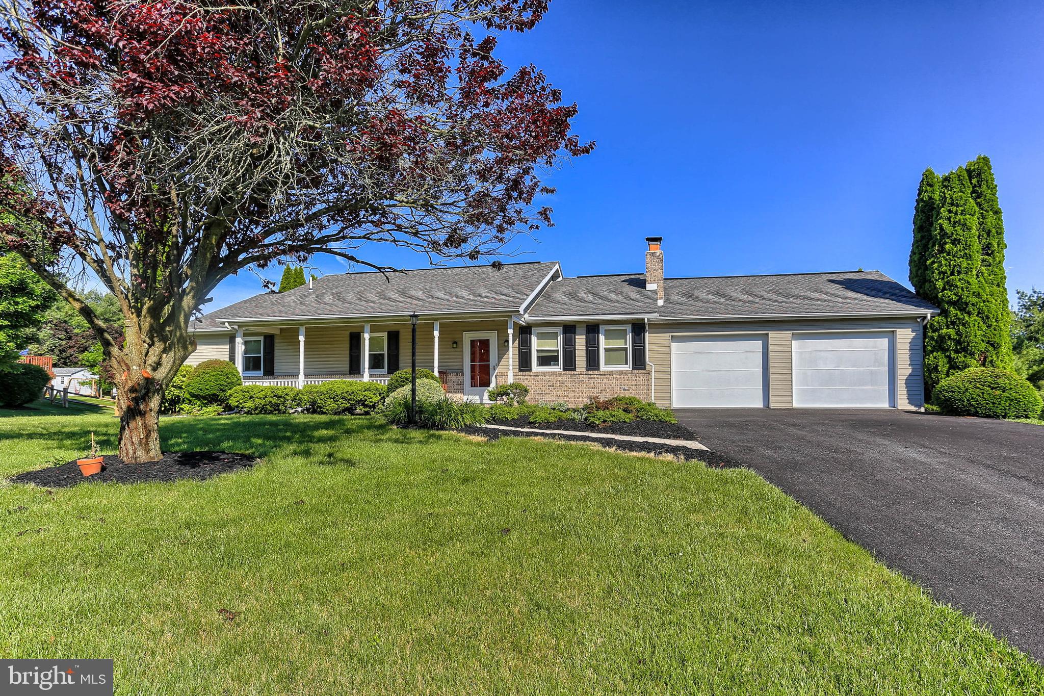Fantastic Rancher in conveniently located established Shrewsbury community!  4 Bedroom, 3 Full Bath classic rancher with LOTS of space on large lot with wonderful upgrades throughout! Open concept Kitchen, Dining and Living Space.  The Kitchen has tons of cabinet and counter space, large center island with breakfast bar, quartz counters and stainless steel appliances.  There is a Dining Area and Living Room  with laminate floors, slider access to the large rear deck and the centerpiece of the space is the large, wood burning, stone front Fireplace.  The Master Bedroom has a walk-in closet and private full bath.  Two additional bedrooms, Full Bath and large Laundry Room with outside access to the deck completes the main level.  The finished lower level offers a 4th Bedroom, Full Bath, huge Family Room space with outside access to the patio area and a Bar with sink, and storage - perfect for entertaining.  There is a large workshop/storage area that could be finished for additional living space and a utility room for easy access to the mechanicals of the home.  Covered front porch, attached over sized 2 car garage with outside access, level rear yard, located in Southern School District and convenience to shopping, dining and commuter routes completes the package!  A must see Rancher - a rare find!