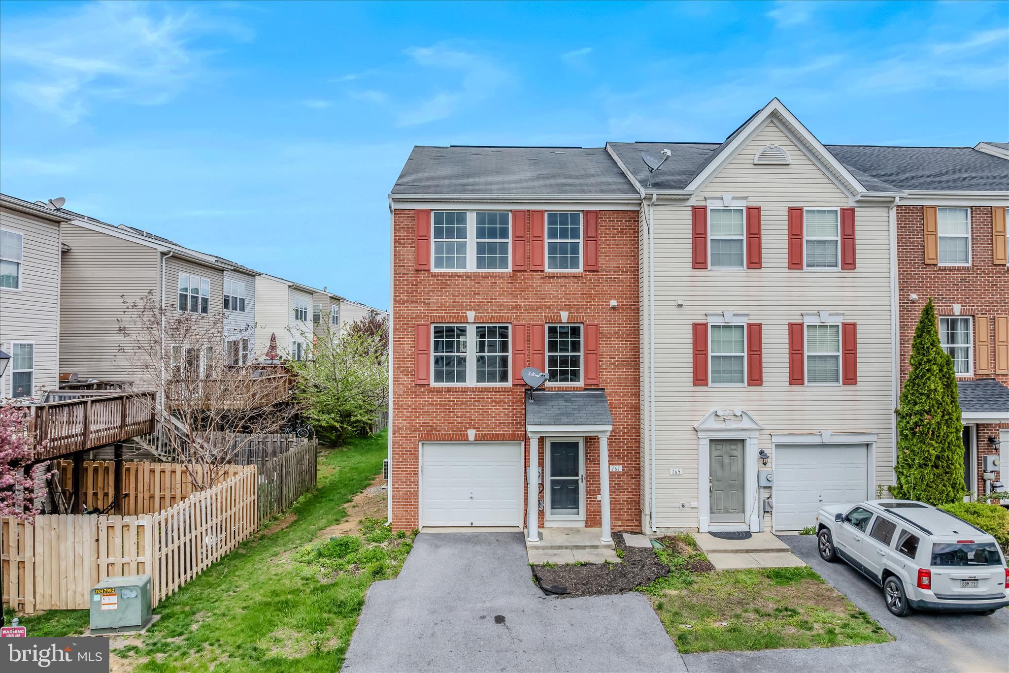 Welcome to 161 Veronica Drive in Martinsburg! This beautifully maintained end-unit townhome features a timeless brick front, new luxury vinyl plank flooring, and fresh paint throughout, giving the home a clean, modern feel from the moment you step inside. Offering generous living space, this home combines comfort and functionality with a bright, inviting layout perfect for everyday living and entertaining. The spacious kitchen provides plenty of cabinet and prep space, while the living and dining areas flow nicely for an open, comfortable feel. Upstairs, you’ll find well-sized bedrooms including a spacious primary suite with tray ceiling detail, creating an elegant retreat at the end of the day. The primary bath offers a soaking tub, perfect for relaxing and unwinding. The lower level provides additional flexible living space ideal for a rec room, home office, gym, or guest area. Step outside and enjoy the large rear deck, offering great space for outdoor entertaining, grilling, or simply enjoying the fresh air. As an end unit, this home also benefits from added privacy and natural light. Conveniently located near shopping, dining, schools, and commuter routes, this move-in ready home offers space, style, and convenience all in one!