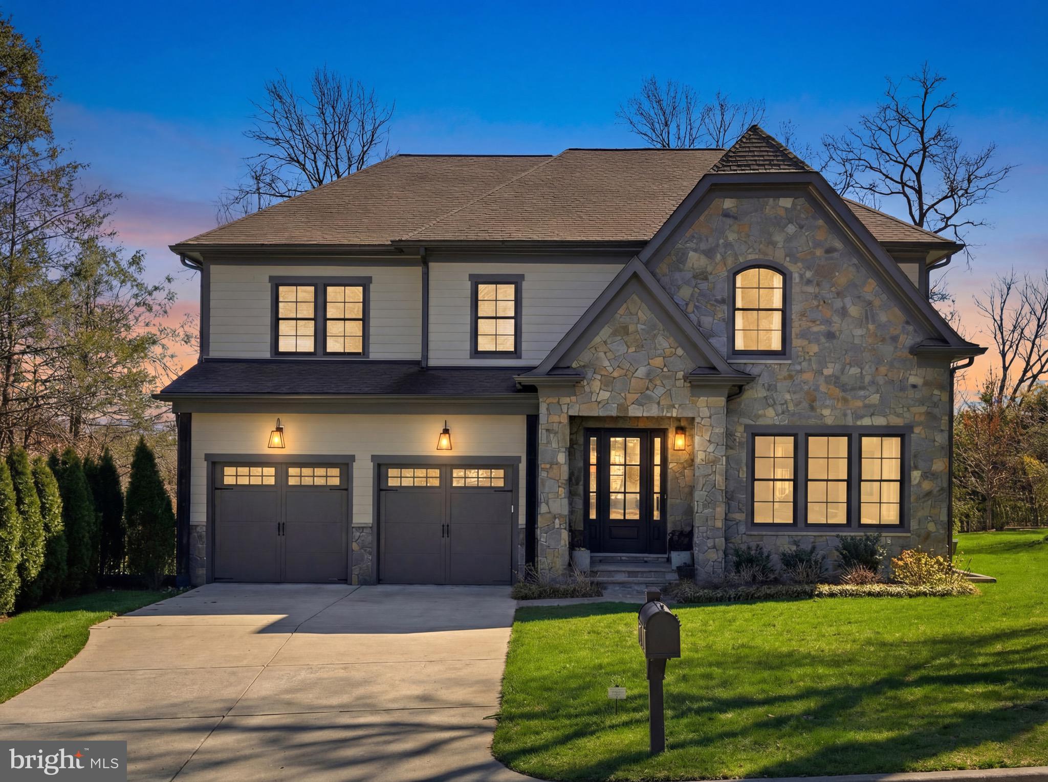 A rare offering at the end of a quiet cul-de-sac in Salona Village, just moments from downtown McLean. This is the home you've been waiting for!
Built in 2020 and thoughtfully maintained, this French Craftsman–inspired residence offers 6 bedrooms and 6 full baths with a layout that feels both refined and easy to live in. The main level is introduced by soaring ceilings and a grand two-story staircase with custom iron balusters, creating a strong architectural focal point, with detailed millwork carried throughout for added elegance.
The main level flows from formal living room and a private dining room into a light-filled family room anchored by a gas fireplace, coffered ceiling, and custom trim. The kitchen is centered around an eat in island with quartz countertops and appointed with a custom range hood, Wolf and Sub-Zero appliances, custom cabinetry, and a butler’s pantry connecting seamlessly to the dining space. The adjoining morning room opens to a covered porch and patio, overlooking a wooded setting that offers both privacy and calm.
A main-level bedroom with full bath creates a private, comfortable space for guests, extended stays, or an au-pair, with a washer and dryer conveniently located off the mudroom. A mudroom with built-ins connects directly to the spacious two-car garage.
Upstairs, each bedroom is paired with its own en-suite bath, along with an open loft and an expansive laundry room with built-ins, easily suited for additional workspace or crafts room. The primary suite is sunlit and quiet, with tree-lined views, two walk-in closets, and a bath complete with a walk-in shower, soaking tub, and separate dual vanities.
The walkout lower level is designed for both entertaining and everyday living—featuring a fully equipped wet bar, recreation room, exercise room, flex space, additional bedroom, and full bath, with direct access to a private patio that extends the living space outdoors.
Offered with the ease of newer construction—without the timeline—this is a rare opportunity to own a home that balances design, function, and location in one of McLean’s most established neighborhoods. Schedule a private showing to experience it firsthand.