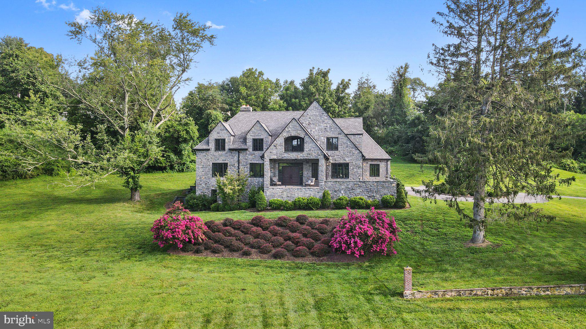 Nestled within a serene and private 13.6-acre estate, this custom-built home stands as an unparalleled masterpiece in Chester County. Crafted with impeccable attention to detail, the residence boasts authentic natural stone gracing its exterior and paver patios that frame incomparable vistas of the Chester County landscape. 

The exterior is adorned with genuine natural stone, while an inviting paver-front porch and secluded back patio beckon, creating an idyllic backdrop for entertaining. Designed with a keen focus on comfort, this residence welcomes you with a grand foyer featuring lofty ceilings, intricate custom moldings, and exquisite finishes, accompanied by the warmth of hardwood and tile flooring that grace the first floor. Upon entering, a spacious family room awaits to the left with a wood-burning fireplace, and to the right, an expansive dining room stands ready. Adjacent to the dining area lies an eat-in gourmet kitchen, complete with custom cherry cabinets, a gas stove, double ovens, stainless steel appliances, and stunning stone and onyx countertops. Continuing along this corridor, a private back office and powder room await, along with a first-floor primary suite, versatile enough for either family or guests. The first floor harmoniously combines functionality, a seamless flow, and abundant natural light.

The allure of the second floor matches the magnificence of the first, featuring hardwood floors and lofty ceilings throughout. Four generously proportioned bedrooms grace this level, including a second primary suite showcasing a gas fireplace, an oversized walk-in closet, and an ensuite bathroom boasting a soaking tub, tiled shower, and dressing area. Along the hallway, a tranquil reading nook provides a serene space for relaxation while overlooking the rolling hills of Chester County. Adding to the allure, a substantial rear room offers the versatility of an extra bedroom or an inviting secondary sitting area.

The walkout basement offers a blank canvas, encouraging the creation of a gym, a movie room, a bar, a wine cellar, or any other imaginative vision that comes to mind.

Demonstrating abundant offerings, the property also features a detached three-car garage in as-is condition could be a haven for car enthusiasts or an ideal workshop space. 

The main residence enjoys a coveted location in Kennett Square, just minutes from the esteemed small town that is Kennett Square. An epicenter of activity, it provides an array of shopping, dining options, artistic pursuits, and more. Moreover, this property offers convenient access to Philadelphia, Delaware, and Maryland, solidifying its stature as a home that seamlessly combines luxury, seclusion, and an enviable locale.