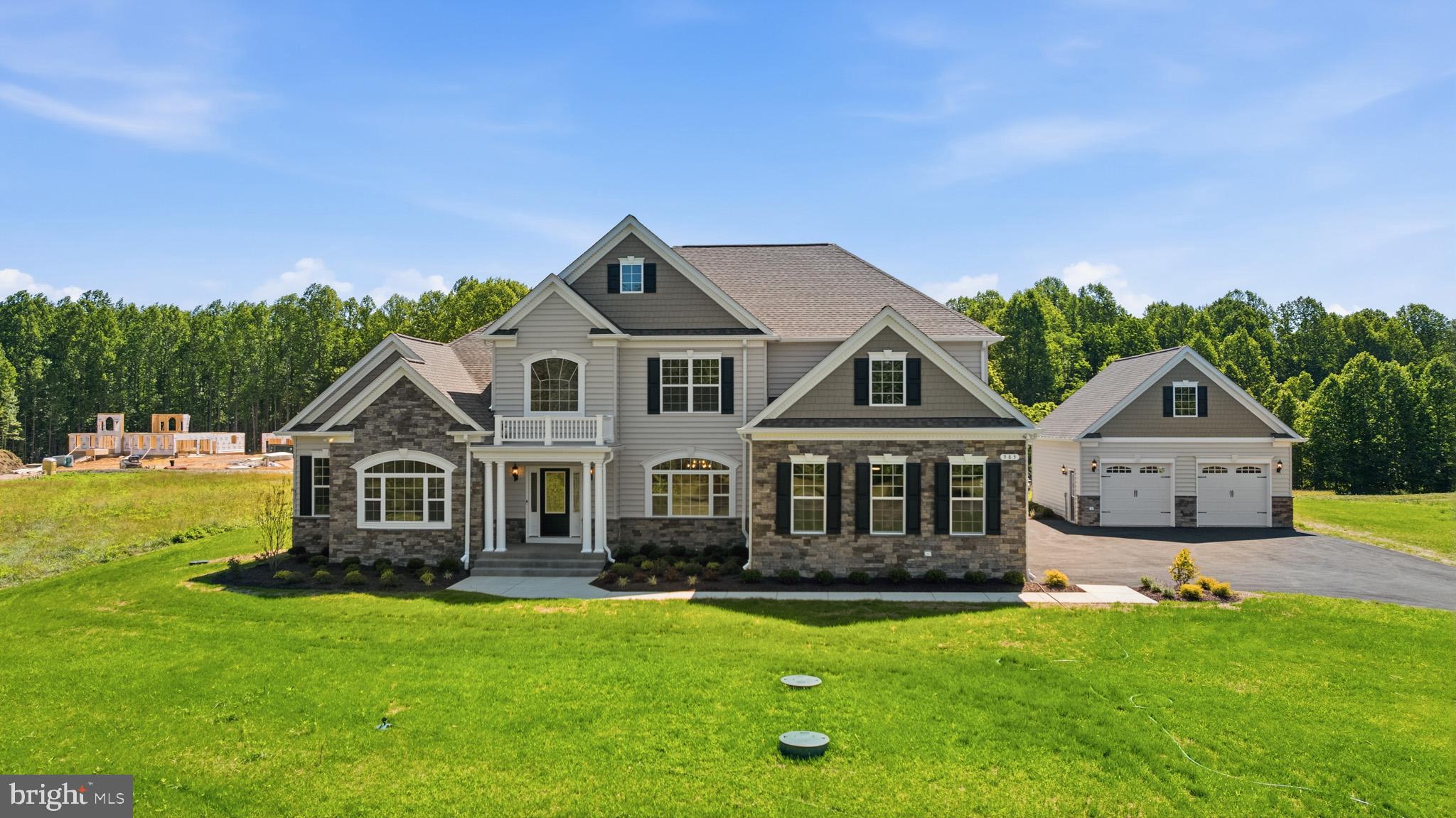 Quality Built Homes "customized" Somerset being built on a gorgeous lot (Open space, approximately an additional 15.488 acres conveys) in Owings, MD!  From the moment you walk in to the foyer, you will love the large plank hardwood flooring, upgraded lighting, primary bedroom on the main level with it's OWN washer and dryer, tray ceiling and on suite bath has separate vanities, soak in tub, and deluxe shower with stunning subway tiles and pebbled flooring. The walk in closet is the size of a bedroom with an Island and custom shelving.  Family Room has a coffered ceiling and gas fireplace for many cozy days/nights, separate dining room with butlers pantry, study, and sunroom that goes out to a beautiful stamped patio.  The kitchen would be any ones dream with a Large Island, stunning granite and lighting, double set of refrigerators/freezers, gas cooktop, built in microwave, farm sink, and double wall ovens. The upper level has a large extra room (above family room) for an extra family room, game room, kids room, endless possibilities. All 3 bedrooms have their own full bathrooms and walk in closets with custom closets plus another laundry room on this level.  The basement has 9' walls, a very large recreation room, media room, bedroom and bathroom and still plenty of storage area and french doors to the areaway leading outback.
