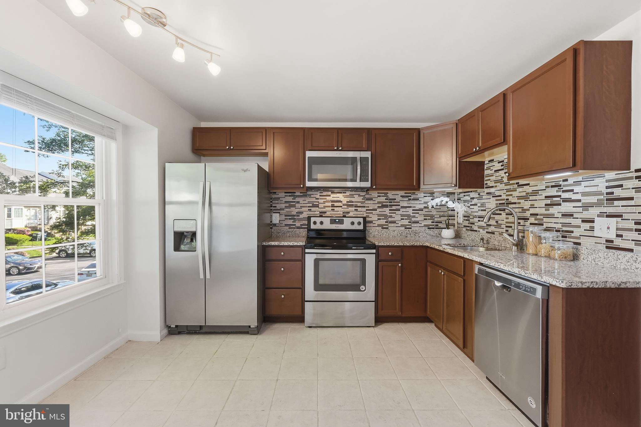 NEW PRICE! DON'T MISS the 3D Tour and Walkthrough Video! Beautifully updated 3BR/2.5BA townhome in the sought-after Meadowcroft neighborhood of Crofton, MD. The kitchen dazzles as the heart of the home with stainless steel appliances, granite countertops, and newer windows. The main level offers plenty of room for a family room, separate dining area, and flex space perfect for a sunny home office, plus a private rear deck and half bath. Upstairs, the spacious primary suite features two large closets upgraded with California Closet systems and a beautifully updated ensuite bath. The laundry room is conveniently located on the upper level alongside two additional bedrooms and an updated hall bathroom. Ceiling fans were added throughout this home for extra breezy comfort. This home was fully remodeled in 2018. The lower-level walkout opens to a private, fully-fenced stone patio - ideal for entertaining, relaxing, or summer BBQs. Meadowcroft puts everyday convenience within easy reach. The community library, community garden, lake and playground are all walkable. Just minutes away you'll find the Crofton Giant, At Home, Gold's Gym, ACE Hardware, and a variety of restaurants. Tee it up at the The Walden Country Club or try their tennis courts, pool or their delicious bar & grill. Crofton Elementary and their adjacent Hardy Field are also very walkable and Route 3/450 provides quick access to just about anywhere you need to go.