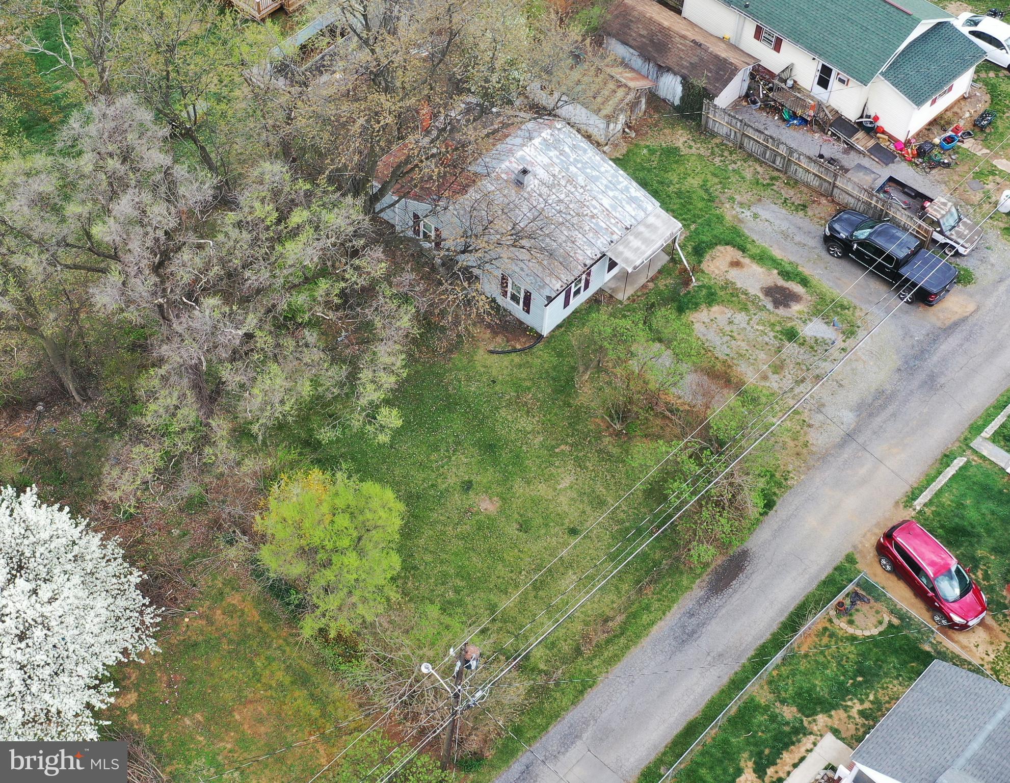 INVESTMENT OPPORTUNITY! UNBEATABLE PRICE! The choice is yours.  Rehab this fixer upper or remove it and build another house in its place. In Sunnyside, off Rt. 522 north of Winchester and near Rt. 37. Convenient to shopping and services and a short drive to historic downtown and Winchester Medical Center.  Priced well below the current tax assessed value of $129,100.  Level lot with a 2-bedroom, 1-bath 1940s cottage with hardwood floors and 7-foot ceilings.  Shed 10x16. Room for parking in the front. Kitchen has a double sink and a built-in desk. Please note: This property is sold strictly as-is, where-is. Buyers who view this property must be accompanied by an agent. Lot size approximate.