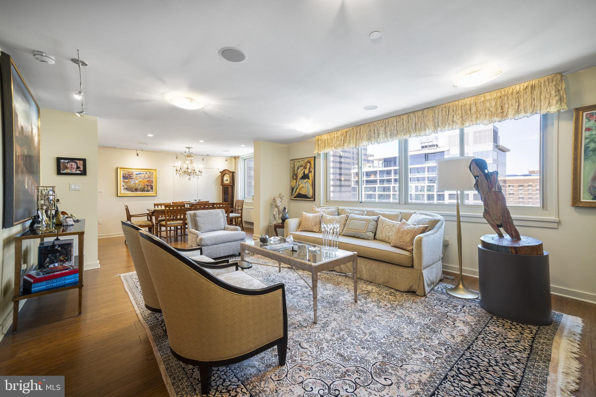 Perched high above the rooftops of Center City on the 29th floor of the iconic William Penn House, this truly one-of-a-kind residence offers an exceptional living experience. Thoughtfully combined from three separate units, this expansive home features four distinct bedroom/office spaces and a seamless blend of style, comfort, and versatility.

An abundance of soft, indirect natural light pours in through oversized windows, illuminating every corner of the home. The main residence welcomes you with an entry foyer and two large closets, leading into an impressively spacious living and dining area with ample wall space for art and entertaining. The custom chef’s kitchen is both functional and striking, showcasing Quartz waterfall countertops, a GE Monogram refrigerator, GE Profile wall oven, built-in microwave, and a dedicated coffee bar with generous pantry storage.

Two well-proportioned bedrooms and two full baths complete the main unit. The hall bath features a sleek modern vanity and an extra-deep Jacuzzi soaking tub. The secondary bedroom offers excellent closet space, while the oversized primary suite is a standout, boasting a wall of closets, two walk-in closets, a separate walk-in shoe closet, and a beautifully designed tiled bath with walk-in shower, built-in makeup vanity, and abundant storage.

The second unit is a fully self-contained studio apartment—ideal for guests, rental income, or extended living—complete with a full kitchen featuring granite countertops, a spacious living area, and a renovated neutral bath with Quartz finishes and a custom shower. A stackable washer/dryer and additional closet space add to its convenience.

The third unit, with its own private entrance, is currently used as a home office or additional bedroom. It features a wall of custom built-ins, a storage closet, and a full laundry room equipped with front-loading GE Profile washer and dryer, utility sink, and extensive cabinetry.

The William Penn House offers an unmatched lifestyle with a long-standing reputation for stability—never having had a special assessment—and the added benefit of taxes included in the low monthly co-op fee. Residents enjoy access to an attached parking garage (for an additional fee), a rooftop pool and entertainment space, 24-hour security, on-site management and maintenance, a fitness center, hospitality suite, and a full calendar of resident activities.

Located in the heart of Rittenhouse Square, just one block from the park, you’re surrounded by some of the city’s best dining, shopping, cafés, and everyday conveniences—making this an ideal opportunity for elevated city living.