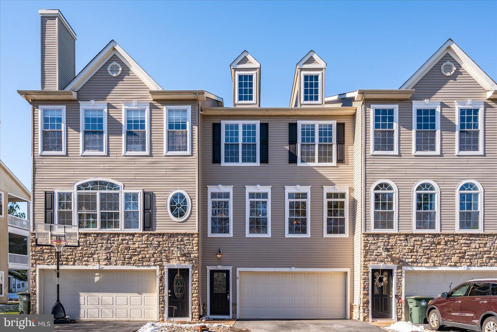 BEST VALUE IN THE TOWNES OF BERLIN!

Priced to reflect cosmetic updates and personal touches a new owner may wish to make, this home presents a rare opportunity to gain instant equity in a community where comparable homes are currently offered at significantly higher prices.

Some buyers may recognize this home from a previous search. Its extended market time was largely attributable to uncertainty surrounding condominium association governance and financial reporting. Thanks to the diligence and persistence of the current owners, those issues have been addressed, a new board is in place, financial oversight has been strengthened, and the association is moving forward with greater transparency and accountability.

Now, buyers can focus on what truly matters: a spacious 3-bedroom, 2 full bath, 2 half bath townhome offering over three levels of comfortable living in one of America's coolest small towns.

Located within walking distance of downtown Berlin's award-winning shops, restaurants, parks, and year-round events, this home combines small-town charm with everyday convenience. Enjoy beautiful pond views from two private balconies and a walk-out patio, creating multiple outdoor spaces for relaxing and entertaining.

The entry level features a versatile bonus room ideal for a home office, recreation room, guest space, or potential fourth bedroom, along with a half bath and private patio access.

The main living level offers an expansive open-concept design with generous living and dining areas flowing seamlessly into the large kitchen and breakfast nook, complete with balcony access.

Upstairs, the spacious primary suite features its own private balcony, walk-in closet, and en-suite bath with soaking tub, separate shower, and double vanity. Two additional bedrooms, a full bath, and laundry complete the upper level.

Additional highlights include abundant storage throughout and an oversized two-car garage.

If you've been waiting for an opportunity to own in The Townes of Berlin at an exceptional value, this is your chance.