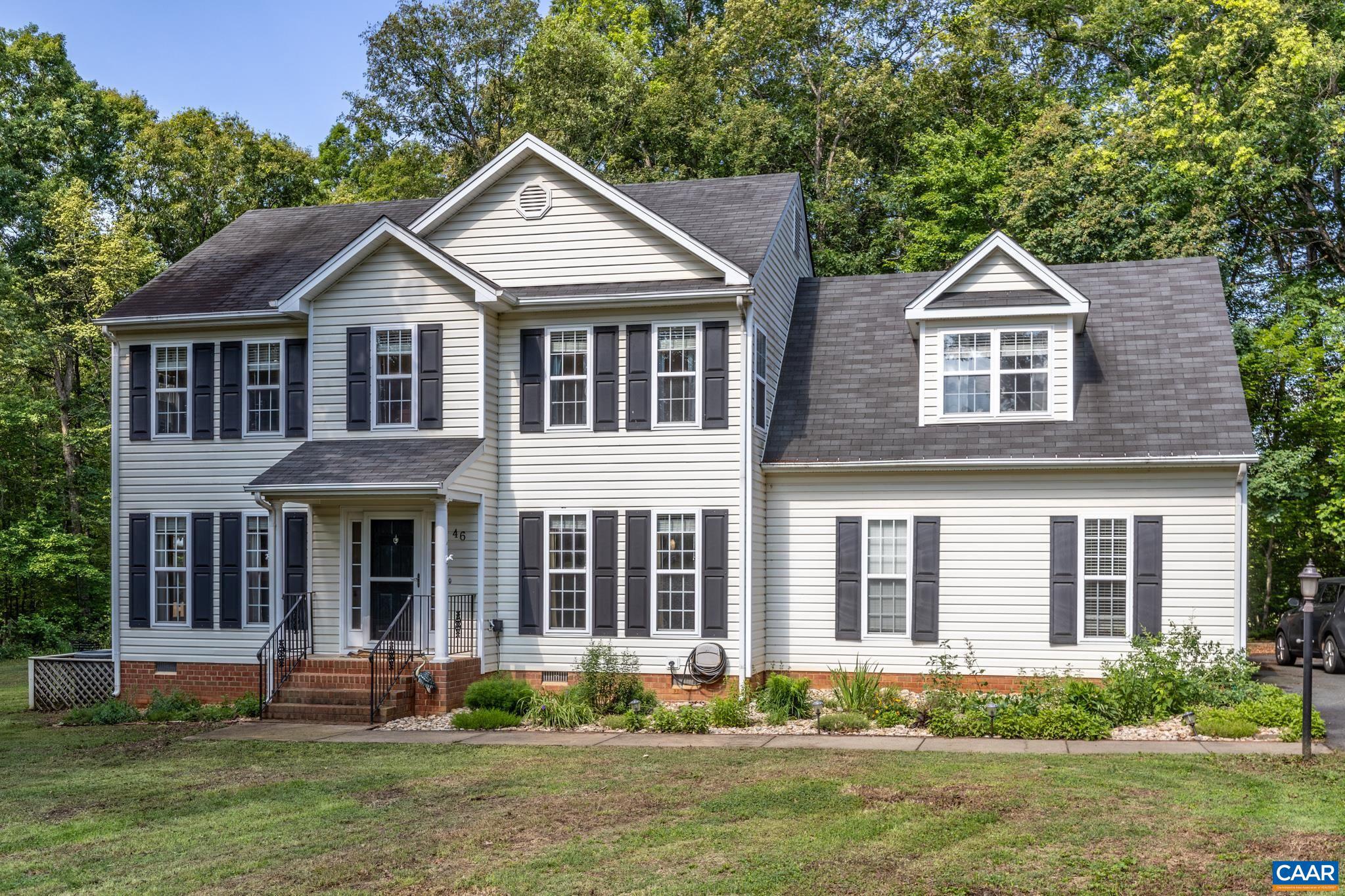 Welcome to this well-maintained home situated on 1.85 private, partly wooded acres in Louisa County. Offering a convenient commute to both Charlottesville and Richmond with easy access to I-64, this property combines quiet country living with modern convenience and no HOA fees. The exterior features a paved driveway, established landscaping, spacious rear deck for outdoor dining, and a fully fenced backyard. The main level features hardwood floors throughout a practical, open floor plan. A separate dining room features a tray ceiling and molding, while the open family room centers around a gas fireplace. The kitchen is equipped with stainless steel appliances, lots of cabinetry, a breakfast nook, and a functional layout perfect for cooking. Upstairs, you will find four generously sized bedrooms and two baths. The primary suite serves as a comfortable retreat, featuring a walk-in closet, a whirlpool soaking tub, and a separate tile shower. Side-load garage for parking and storage with a shed for more storage. Skip the premium price tag, long build times, and expenses of newer construction. This turn-key home includes the refrigerator, window treatments, storage shed, and a fenced-in, private lot. A quick closing is possible.,Cherry Cabinets,Solid Surface Counter,Fireplace in Family Room