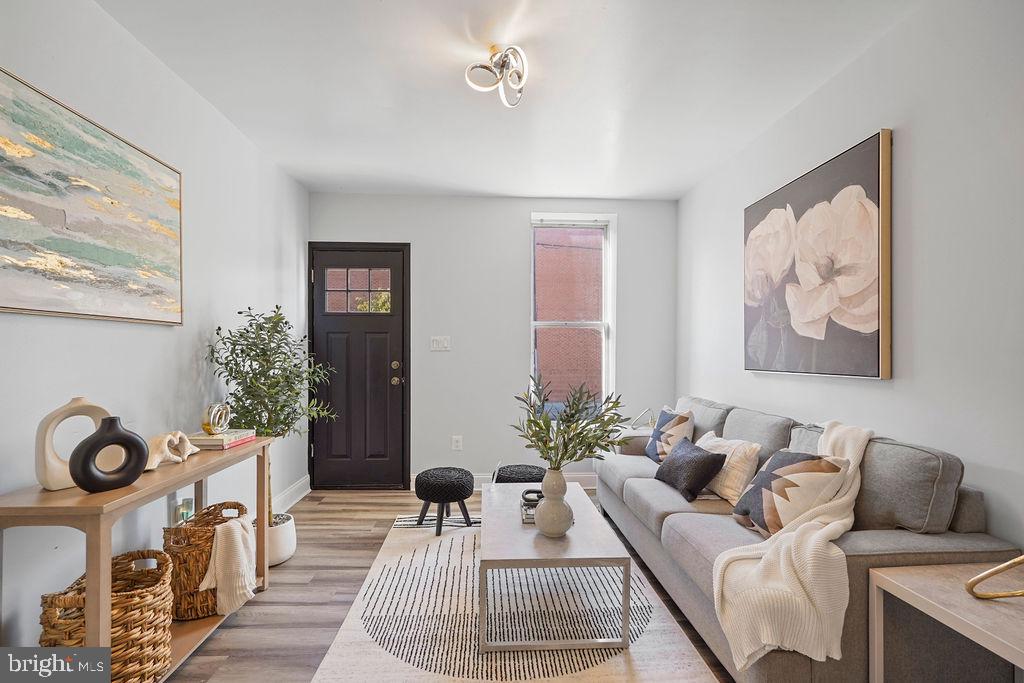 Welcome to this beautifully renovated home in the sought-after historic Pigtown/Washington Village neighborhood! This charming property features 2 spacious bedrooms, 1.5 updated bathrooms, and a modern kitchen equipped with stainless steel appliances, ample cabinet space, and a washer and dryer. The kitchen opens to a private deck and fenced backyard patio, perfect for grilling and outdoor entertaining.

Interior highlights include stylish vinyl flooring, high ceilings, recessed lighting, and a bright, open living room ideal for relaxing or hosting guests. The upper level offers two generous bedrooms and a renovated full bath, while the main level includes a convenient half bath. The full basement provides excellent storage or the opportunity to customize additional living space.

Located on a quiet street in the heart of Baltimore, this home offers city views and is within walking distance to Camden Yards, M&T Bank Stadium, Horseshoe Casino, the Inner Harbor, museums, restaurants, bars, and shops. Enjoy the best of urban living in this vibrant, walkable community. A true gem—don’t miss your chance to make it yours!