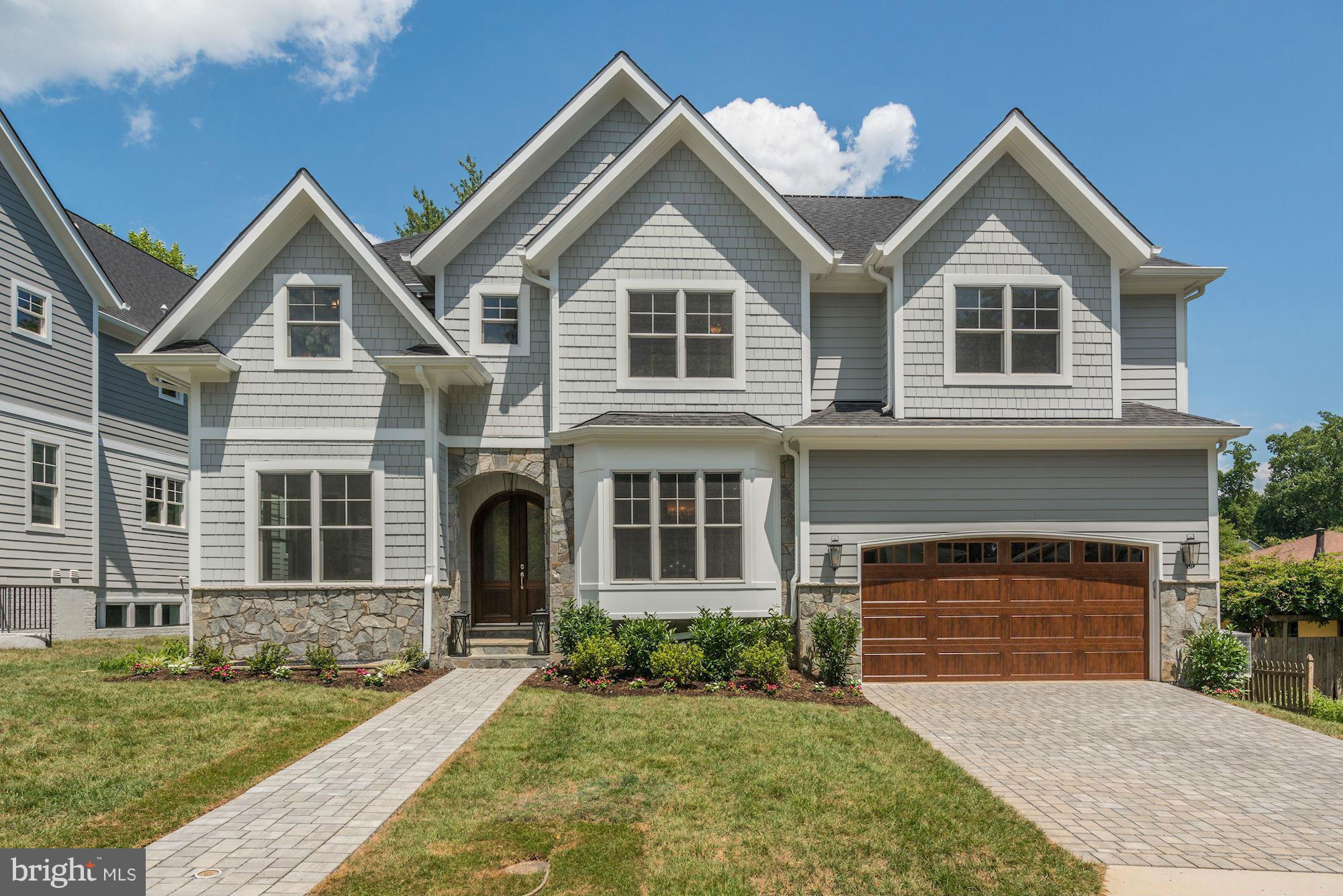 Beautiful custom home! the perfect floor plan! 6 miles from DC, excellent public schools,great neighborhood, 10'ceilings on first floor w/ open floor plan and hard wood floors, lrg gourmet kitchen w/ Wolf gas range, stainless steel appliances,stunning master suite w/gorgeous marble master bath/shower w/soaking tub,lrg walk-in master closets,LL guest suite, excellent craftsmanship!