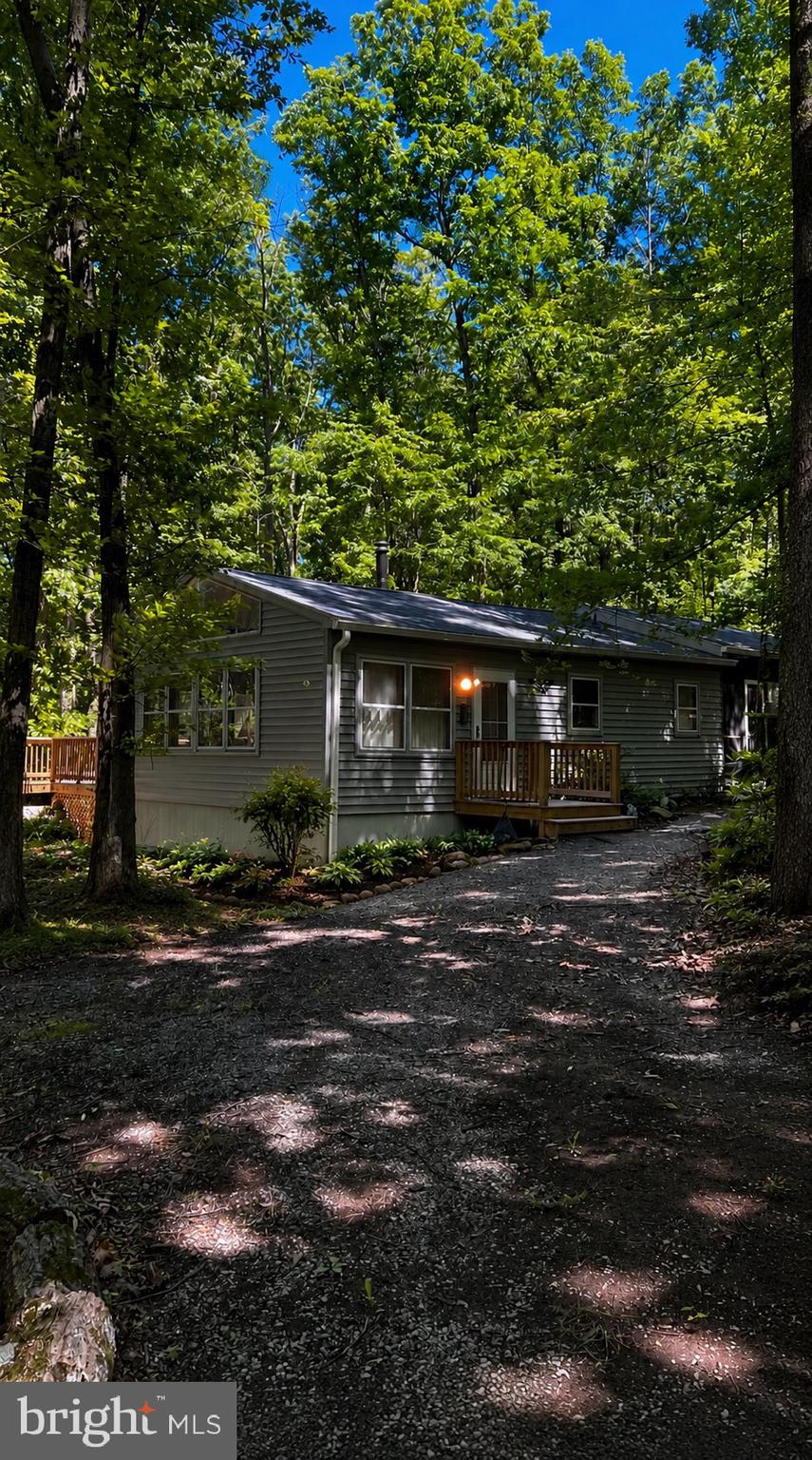 More photos coming soon! Contact the listing agent for additional photos and details in the meantime.

This charming mountain cabin has been maintained and updated  over the years, offering a blend of rustic character and modern convenience. Recent improvements include a new roof, well pump, plumbing, water heater, water softener, decking, and porch. The crawlspace was professionally encapsulated last year, and high-speed fiber optic internet is already installed.

Inside, you’ll find 2 bedrooms and 2 full bathrooms, including a spacious primary suite with a private ensuite bath. Large windows fill the home with natural light, creating a warm and inviting atmosphere. The primary bedroom features beautiful hardwood flooring and direct access to a private screened porch—an ideal spot to enjoy your morning coffee or unwind in the evening. Efficient mini-split systems provide year-round comfort, while a Fisher wood stove adds warmth and can comfortably heat the entire cabin.

Situated on 8 private acres just off the main road, this property offers the perfect balance of accessibility and seclusion. Conveniently located less than 5 minutes from Wardensville, under 30 minutes from Winchester, Virginia, and less than 20 minutes from I-81, you’ll enjoy easy access to shopping, dining, and commuting while still embracing a peaceful mountain setting.

Built in 1987 and carefully maintained throughout the years, this property is ready for its next chapter. Whether you’re searching for a full-time residence, weekend retreat, or investment opportunity as a vacation rental, this cabin offers endless possibilities.

Call today to schedule your private showing!