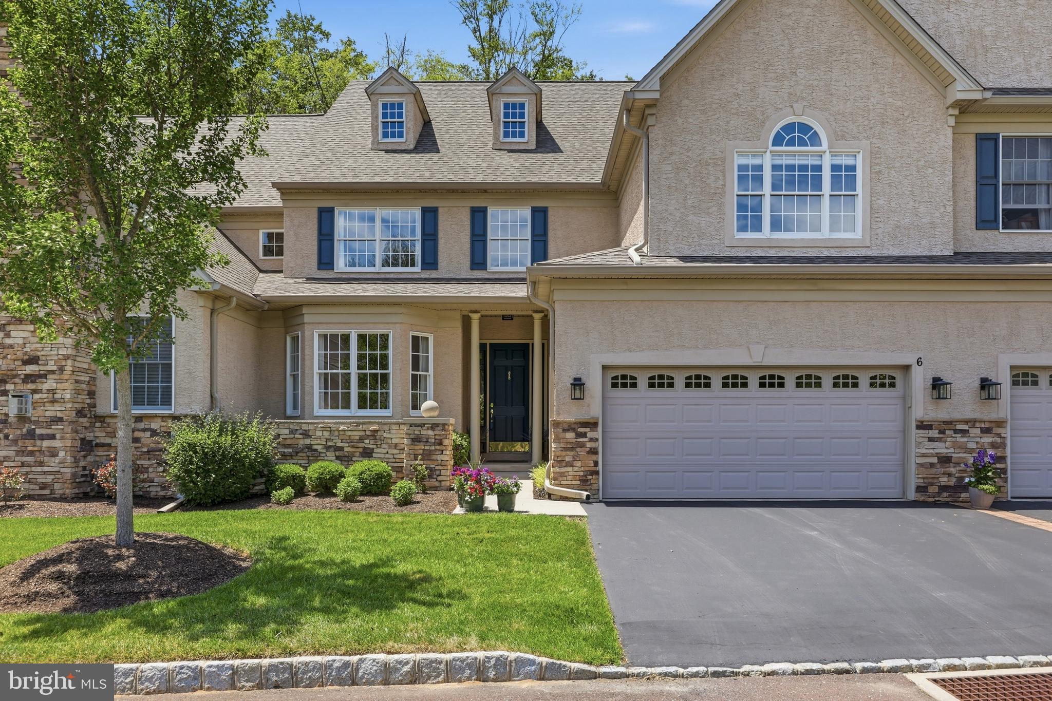 Welcome to 6 Morgan Hill Drive, a stunning home located in desirable Morgan Hill. Built in 2005 and offering nearly 4,000 square feet of beautifully finished living space, plus a finished walkout lower level, this exceptional home combines timeless elegance with low-maintenance luxury living in the heart of Doylestown. Backing to preserved Conservancy land and mature trees, this home offers private access to Central Park and Kids Castle, along with nearby biking and hiking trails that connect to the township’s extensive paved path and park system. Inside, gleaming hardwood and tile floors grace the main level, while brand-new carpeting enhances the second floor. The thoughtfully designed layout features formal living and dining rooms accented with classic columns, a spacious family room with a fireplace, and a beautifully appointed kitchen complete with granite-topped island seating and a sunny breakfast nook that opens to the large Trex deck, creating a seamless indoor-outdoor flow ideal for entertaining and everyday living. The upper level offers four generously sized bedrooms, including a luxurious primary suite with two custom walk-ins, Closets by Design, and a luxurious ensuite bathroom. In total, the home features 4 bedrooms, 3 full baths, and 2 half baths. The finished walkout basement provides exceptional additional living space, including a family room, exercise room, media and game room areas, plus two additional storage areas, with access to a paver patio and views of the tranquil preserved land. Extensive upgrades and amenities include a new roof in 2023  with gutter guards, a water softener with a carbon filtration system, a Flo by Moen water protection system, an alarm system, and a whole-house Generac generator for added peace of mind. The home is located within the highly regarded Central Bucks School District.