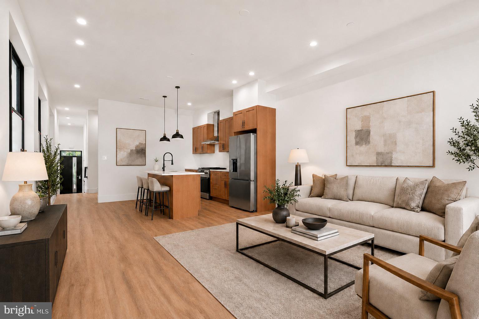 Welcome to 330 Carson Street, a beautiful new construction home in the heart of Manayunk, just minutes from Main Street, local restaurants, coffee shops, parks, trails, and easy access into Center City Philadelphia. This thoughtfully designed 3-story residence features tasteful finishes throughout, extra-high ceilings, durable LVP flooring, and a convenient front-loaded GARAGE PARKING. The main level offers a bright and spacious open-concept living, kitchen, and dining area, creating the perfect layout for everyday living and entertaining. Oversized windows at the front, rear, and along the side of the home fill the space with natural light, giving the home an open and airy feel. A powder room and access to the rear patio complete the first floor. The second level includes two well-sized bedrooms, a full bathroom, and a dedicated laundry room. The third floor is home to the private primary suite, featuring a large walk-in closet and a spa-like bathroom with a soaking tub, elegant finishes, and a relaxing retreat-like feel. There is also the option for a wet bar leading up to the expansive roof deck. Enjoy outdoor living from both the rear patio and the incredible rooftop deck, offering sweeping views of Manayunk and the Philadelphia skyline. Located near the best of Roxborough and Manayunk, with quick access to Main Street, Wissahickon Valley Park, Kelly Drive, public transportation, shopping, dining, and major commuter routes, this home combines modern new construction living with one of Northwest Philadelphia’s most convenient locations. Home is being sold with an approved tax abatement and 1 year builder's warranty.