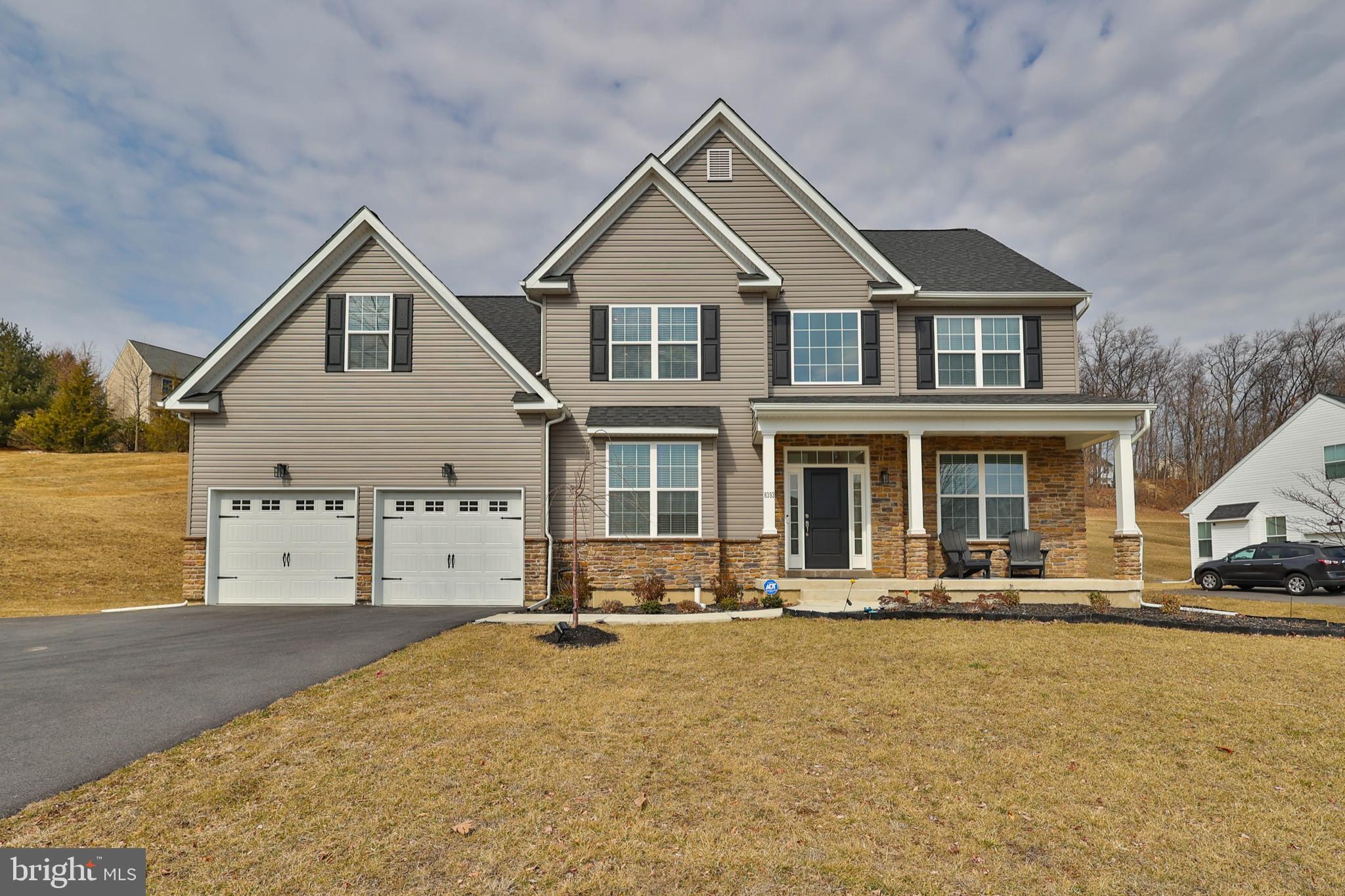 Welcome to 8393 Scenic View Drive, in the beautiful Valley West Estates neighborhood of Upper Macungie Twp, PA.  This wonderful under-2-year-old home is part of the highly rated Parkland school district. You are greeted with a large open foyer as you enter the house.  On the left is an Office/Library with glass French doors for privacy, and to the right, a Formal Living Room and Dining Room featuring a coffered ceiling.  To the back side of the home, you will find a white kitchen featuring a large island, granite counters, and stainless-steel appliances.  Just off the kitchen is a spacious family room with a gas fireplace, cathedral ceiling, and recessed lighting.   A sliding door off the kitchen lets you walk out on your maintenance-free Trex deck.  The main level also features a large laundry area, a half bath, and walk-out access to the two-car garage.  Just up the stairs is the primary suite with his and her walk-in closets, a bonus room, three additional generous-sized bedrooms, and a full bath.    The unfinished basement, created on a state-of-the-art foundation, is a blank canvas. Egress access and a bathroom rough-in allow for a future bed/bath and additional living space.