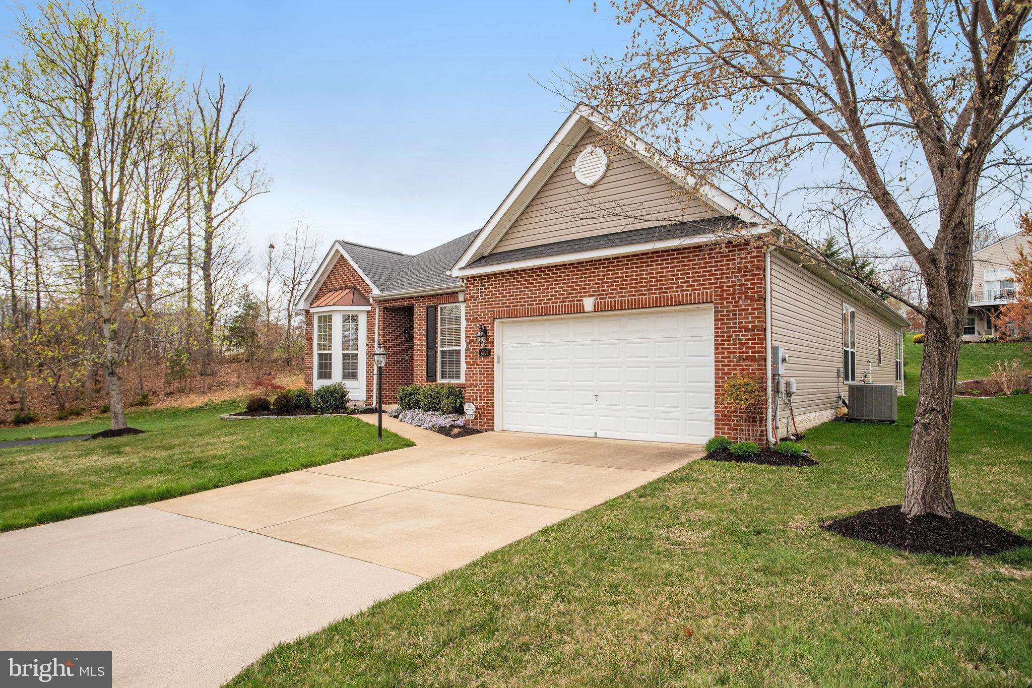 You will not want to miss this amazing home on the largest lot at Four Seasons in Historic Virginia. This home sits right at the end of a private drive and right at the entrance of this beautiful 55+ community. One level living at its finest. This immaculate and well cared for home features new hardwood flooring. 3 bedrooms, 2 full baths and one half bath, living room, dining room, family room with gas fireplace, sunroom and gourmet kitchen. Eat in kitchen features granite, island and stainless steel appliances. You will not believe the size of the primary bedroom with ample closet and spacious private bath with tub and shower. Walk out from the sunroom or primary bedroom to the beautiful stamped concrete patio perfect for entertaining. Professionally landscaped. 2 car garage and plenty of additional parking. New washer / dryer. New roof 2023. New HVAC 2022. New attic insulation. New siding. Enjoy all the amazing amenities Four Seasons has to offer. Minutes to I95, shopping, dining and VRE. Come fall in love.