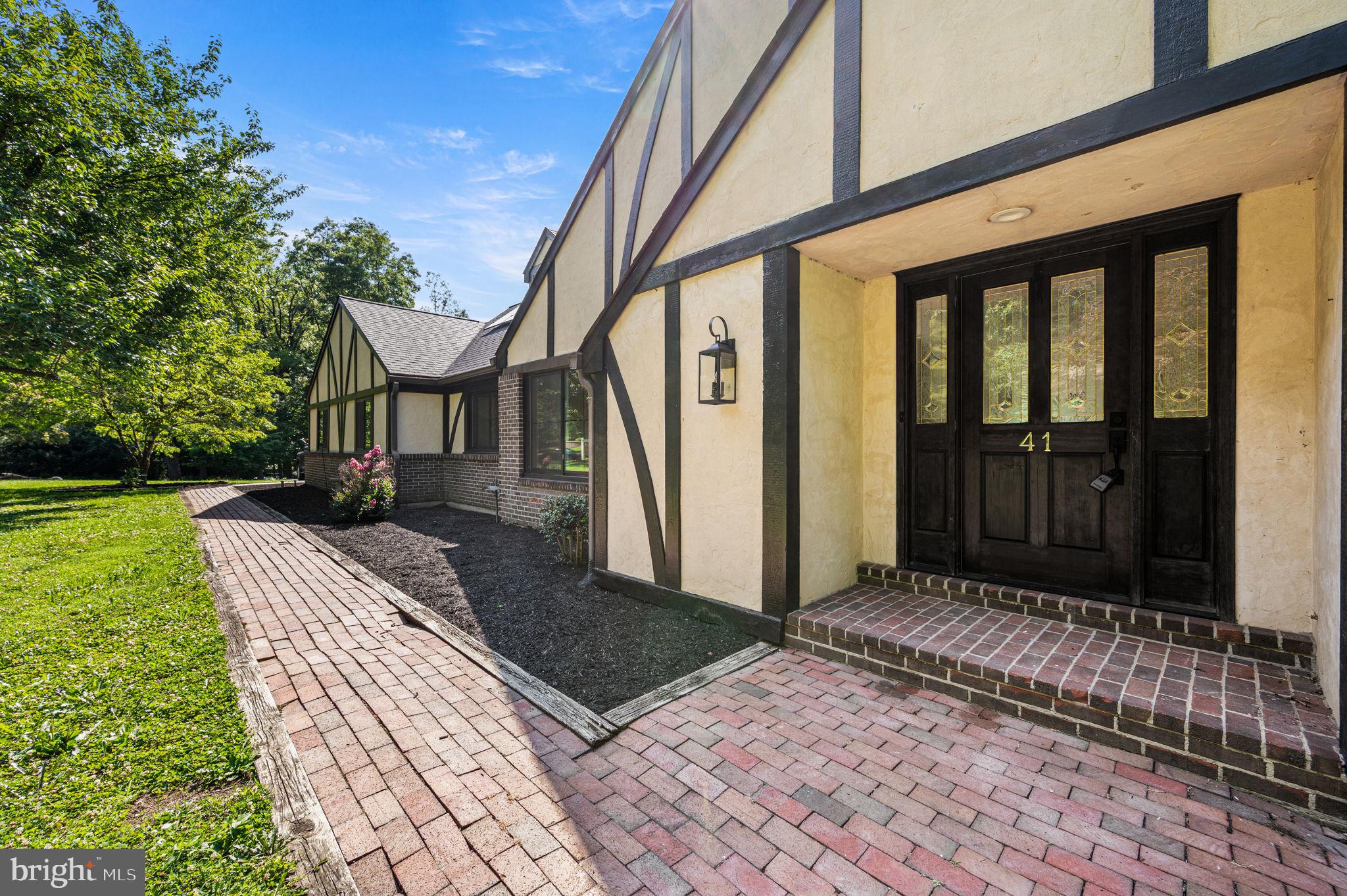 Reimagined, Remodeled and READY for it's next owner!  Nestled on a picturesque 1.33-acre homesite in the highly sought-after Glen Oley Farms community within the Exeter School District, this distinguished Tudor residence blends timeless architectural character with elegant interiors and exceptional craftsmanship.  A grand foyer and impressive oak staircase create a memorable first impression, while rich architectural details—including a coffered ceiling, built-in bookcases, and built-in workspaces—add warmth, character, and functionality throughout the home. High-end finishes and extensive renovations complement the home’s classic design, creating an elegant yet comfortable living environment while preserving its distinctive architectural character.

The main-level primary owner's suite offers a private retreat with a spacious sitting room, expansive walk-in closet with dedicated dressing area, and beautifully updated bath.  The second level offers three generously sized bedrooms and two full bathrooms, providing comfortable accommodations for family and guests alike. There is also a full walk in attic space for abundance of additional storage. 

An expansive deck overlooks the peaceful property and extends the living space outdoors, providing the perfect setting for entertaining or quiet enjoyment of the surrounding landscape. The finished lower level adds approximately 1,700 square feet of flexible living space, with a 5th bedroom and full bath, this space is  ideal for recreation, fitness, media, guests, or an additional home office.

Set amid well-maintained grounds and complemented by a charming fire pit area, the property offers both privacy and a sense of community within one of Exeter Township’s most desirable neighborhoods. 
Combining classic Tudor architecture, quality craftsmanship, high-end finishes, and an exceptional setting, this is a home of lasting character and distinction.

Additional photos to be uploaded soon! Schedule your own private showing today!