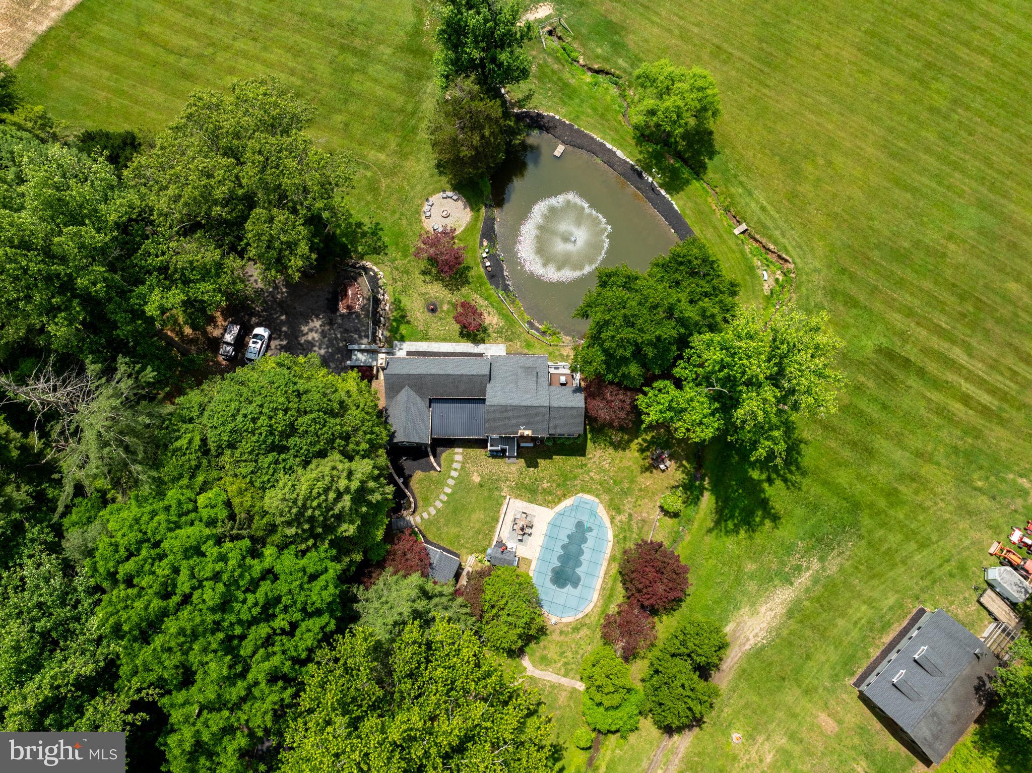 Paradise Awaits!!! 23 Acres of nature, tranquility and peace in Forest Hill/Fallston area in Harford County. Updated 1910 Farmhouse with additions totaling 3500 sq ft+- of living area. Contractors, Fishermen, Hunters, Equestrians, Nature Lovers Delight! Extended family? This one can certainly accommodate. Main Level Boasts Gorgeous cooks Kitchen, Pantry, Formal Dining Room, Formal Living Room with exposed beams and Fireplace, Family Room which opens to a Bright Sunroom and walk out patio/deck overlooking pond with fountain, Main level Primary Bedroom and Bath, and a powder room opening to the exterior for pool lovers use. Second floor offers room for extended family to have own space 2 Bedrooms with their own full baths, a sitting room and a bonus room. Exterior features include Inground pool with pool house/extra Bedroom, 2+ car garage with separate office/living space, Machinery shed, 4 stall Horse barn with tack and feed room plus a loft, Hunting shed down by Winters Run creek with own outhouse (potential vacation rental income?), Pond and more++++ Property is bordered by Winters Run Creek, and 500+ Acres of Hunting Farm/Equestrian.  Hip Camp opportunity? Shiloh Valley Campground.  Schedule your private showing.