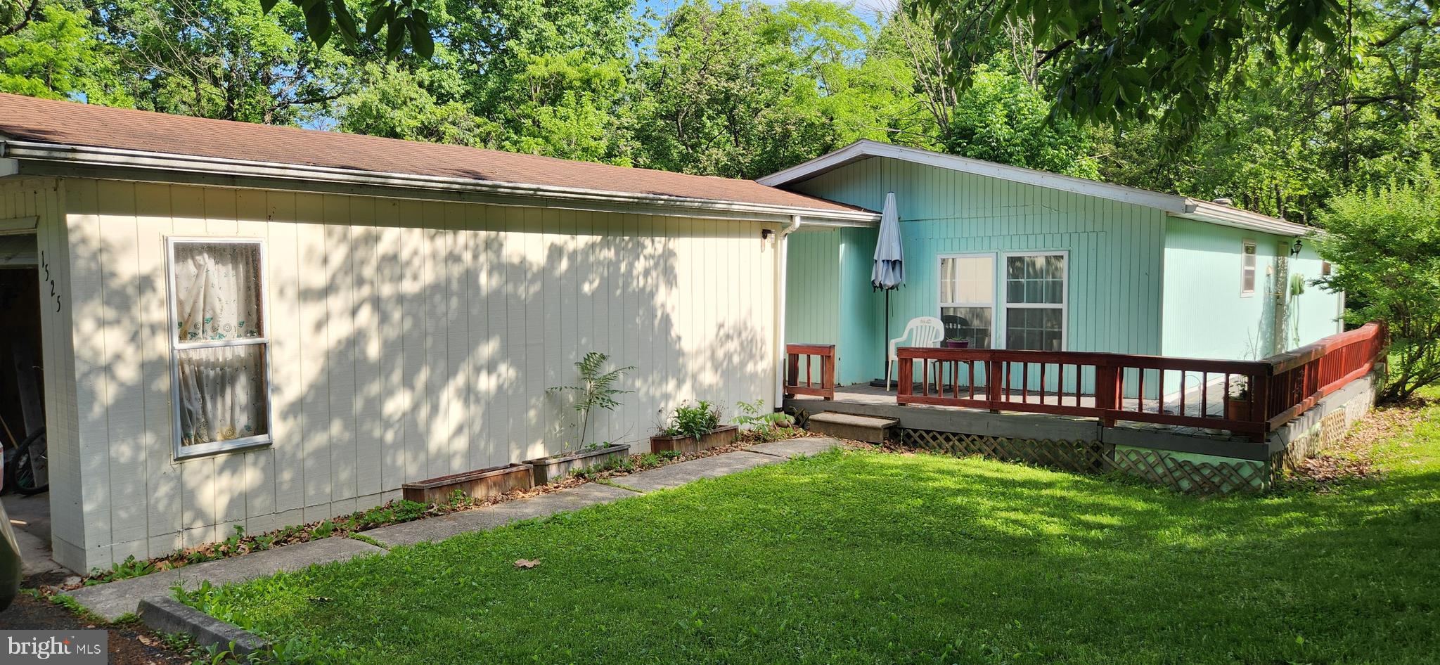 Welcome home to Woodburne Estates!  Come and enjoy this cozy 2 bedroom, 2 full baths Commo model situated on a nice lot.  The home offers a covered front door entry that connects to the 1 car garage, and a porch/deck to sit and enjoy the quaint neighborhood!  It is an open floor plan with LVP flooring throughout.  All appliances will convey.  The land rent is $555.00/month and includes water, sewer and trash.  Buyers do need to meet with the park management  in person to complete an application and receive park approval prior to submitting an offer.  We look forward to seeing you!