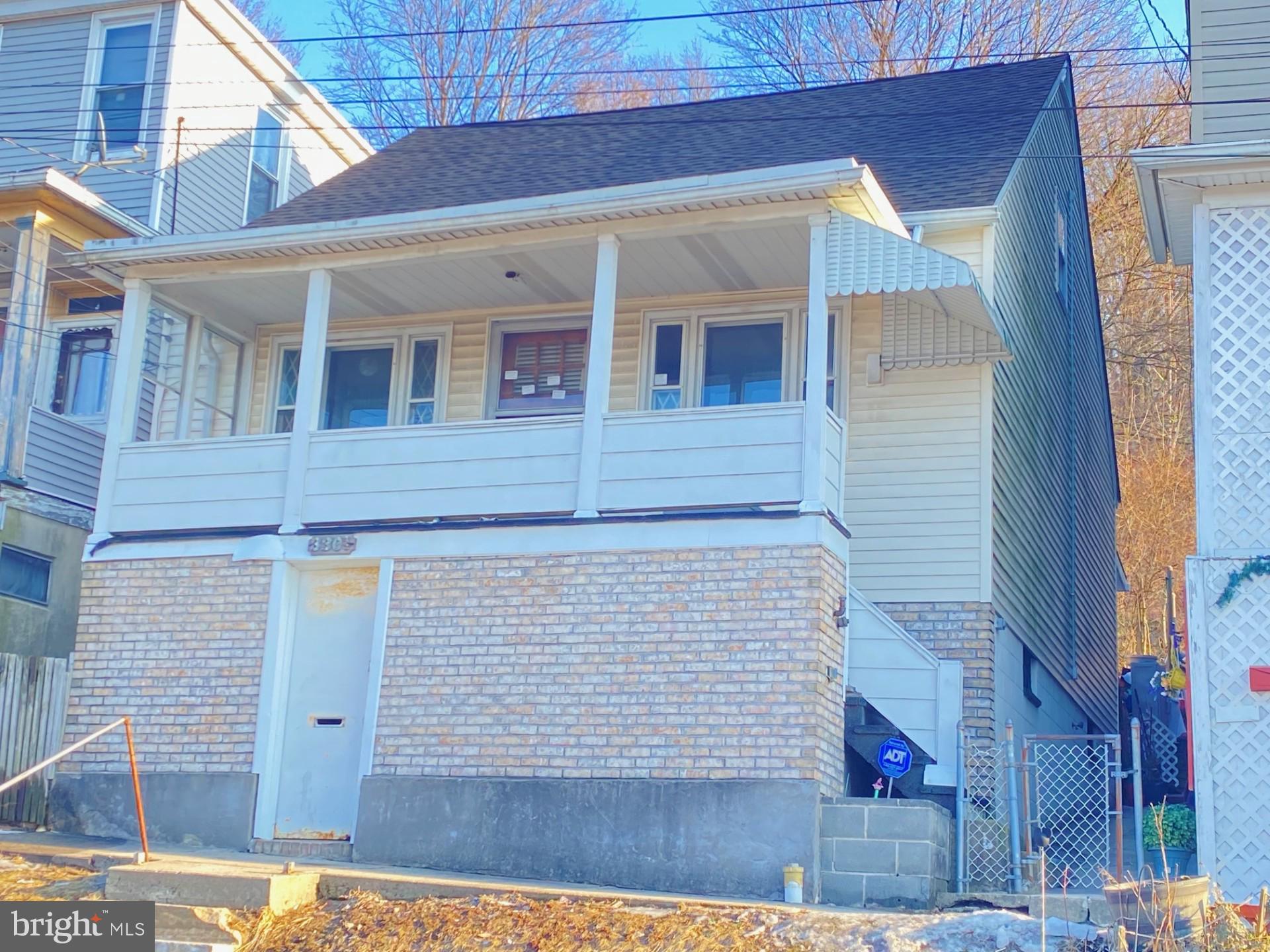 Wonderful Opportunity to turn this house back into a home. Welcome to your next home sweet home—a delightful single-family detached house nestled on a generous street-to-street lot. This charming property is brimming with potential and is ready for you to make it your own. It features inviting covered front and rear porches for relaxation, a spacious living room flowing into a cozy eat-in kitchen, and a versatile room off the kitchen perfect as a formal dining room or first-floor bedroom. A convenient full bath is located off the kitchen, and upstairs you'll find two large bedrooms with additional storage areas. The unfinished basement, accessible from both the front and interior, includes toilet, shower facilities, and a laundry area. Enjoy the seamless indoor-outdoor living experience with easy access to the back porch and backyard from the kitchen, perfect for gatherings and relaxation. All of this is offered for just $67,200—an incredible opportunity!