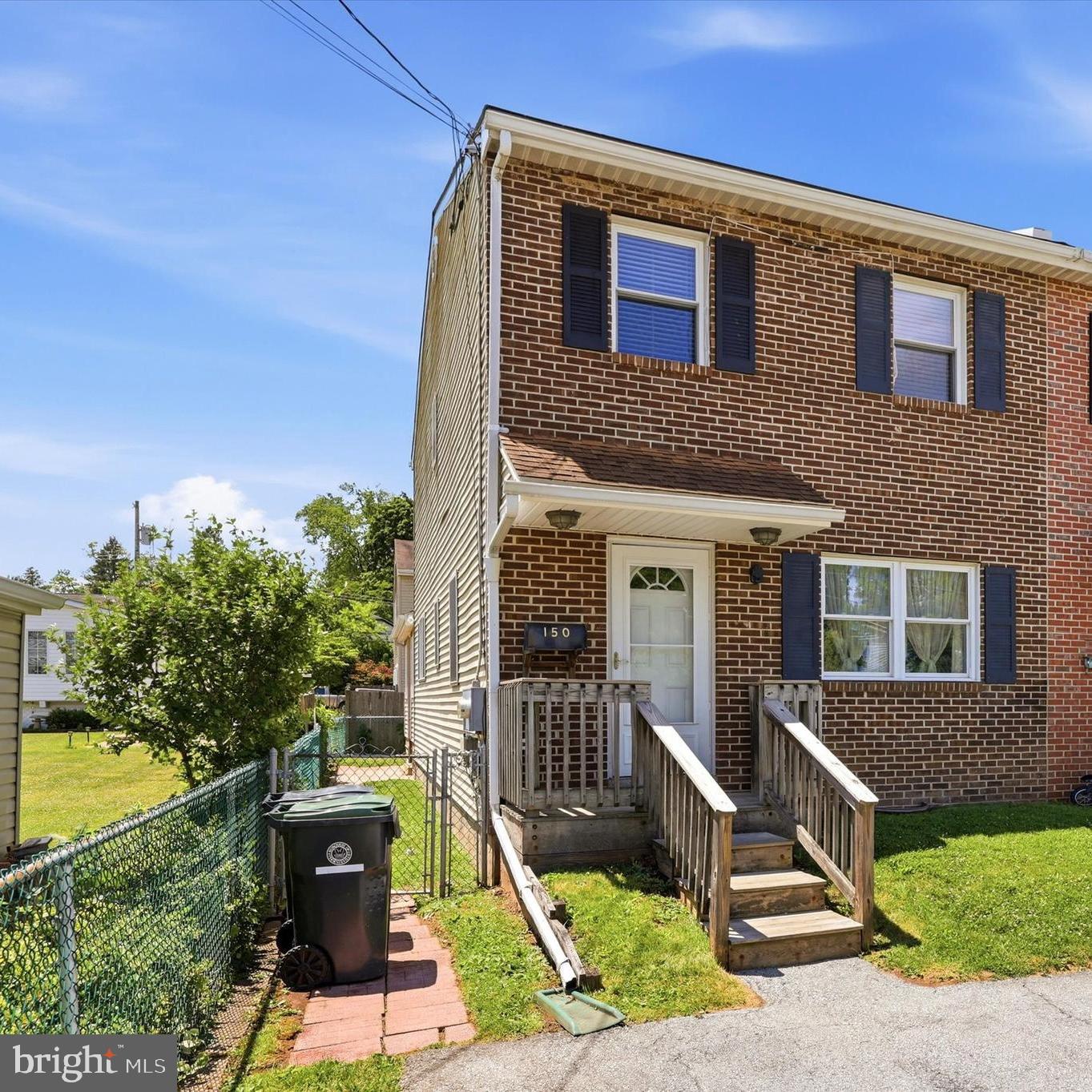 Wow! Don’t miss this spacious 3-bedroom, 1.5-bath end-unit townhome with NO HOA fees and low taxes! Freshly painted and move-in ready.  This home offers plenty of space and flexibility for today's lifestyle. Step inside to a welcoming living room featuring a tiled entry, coat closet, and wall-to-wall carpeting that continues throughout much of the home. The main level includes a convenient powder room and a dining area that flows seamlessly into the large eat-in kitchen. Designed for everyday living and entertaining, the kitchen features an abundance of cabinetry, built-ins, dishwasher, microwave, garbage disposal, and a convenient main floor laundry area.  Just beyond the kitchen, the bright and airy family room (could be a 4th bedroom) boasts a soaring cathedral ceiling with a ceiling fan, and lots of windows that fill the space with natural light the exterior door provides easy access to the backyard.  Upstairs, the spacious primary bedroom offers a walk-in closet and ceiling fan, while two additional generously sized bedrooms provide ample room for guests, hobbies, or a home office. A full hall bath with walk-in shower and a linen closet completes the second floor. The expansive partially finished basement offers endless possibilities for additional living space, recreation, fitness, or workspace, with separate storage areas, a workshop, utility sink, and utility room providing exceptional functionality and organization.  Additional features include central air conditioning, 200-amp electrical service, a programmable thermostat, two off-street parking spaces, paver walkway to side door and freshly painted. If you're looking for space, value, and the freedom of homeownership without HOA fees, this is the place to call Home! 🏡