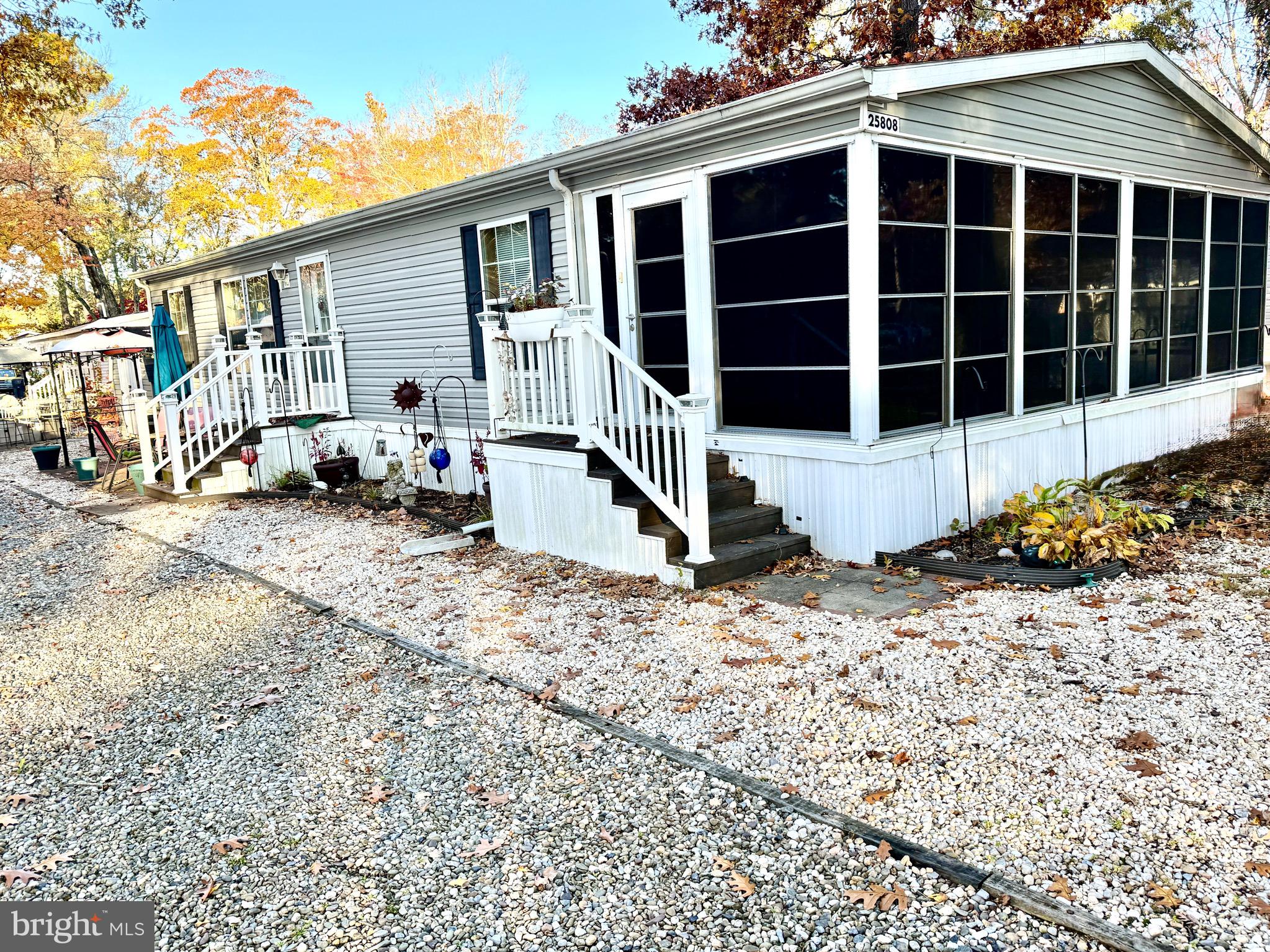 Nestled in the charming community of Sun Retreats Rehoboth Bay, this delightful 3 bedroom 2 bath ranch-style manufactured home offers a perfect blend of comfort and convenience. Built in 2007, the property is in very good condition and features a warm, inviting interior that includes a spacious family room off the kitchen, ideal for gatherings. The combination kitchen/dining area is perfect for entertaining, while the entry-level bedroom and walk-in closets provide ample storage. Step outside to enjoy the three season porch, where you can relax and soak in the serene surroundings. The community boasts a beautiful in-ground pool, perfect for those sunny days, and a gazebo for leisurely afternoons. The neighborhood is known for its friendly atmosphere and offers easy access to local amenities, providing plenty of opportunities for outdoor activities and relaxation. Residents benefit from nearby public services and schools, ensuring convenience for all. The community's commitment to a vibrant lifestyle is evident in its well-maintained amenities and welcoming spirit. With easy access to water-oriented activities, this home is a true retreat for those seeking a peaceful yet engaging environment. Experience the joy of living in a community that feels like home, where every day brings new opportunities for connection and relaxation.  Active pending release.
