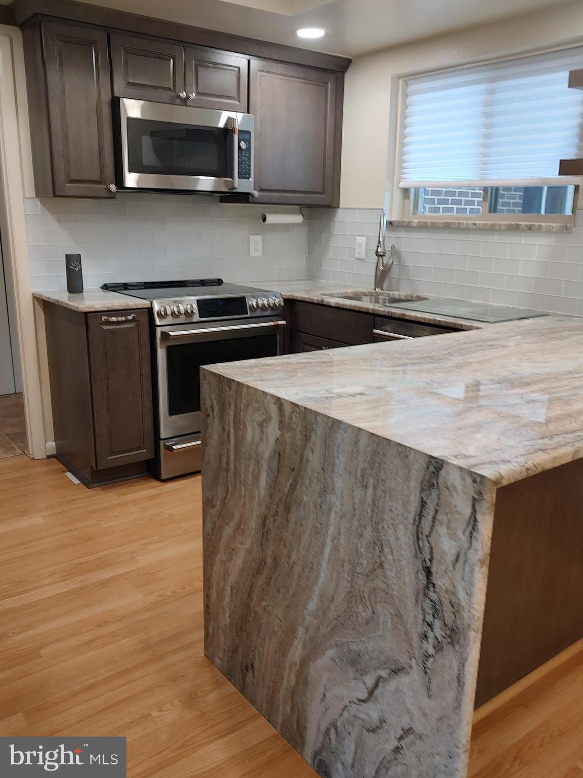 Upper level 2 BR , 1-1/2 BA ELIZABETH model COOP with UPGRADES GALORE!  Redesigned Kitchen  with GRANITE topped cabinets.  Built-in Microwave,   Refrigerator/freezer with water dispenser and ice maker.  Undated Baths Vanities with Cambria Luxury Quartz.   Recessed lighting in Kitchen and Dining Room.  NEW HVAC and WATER HEATER (July ).  View of trees and the Golf Course from this quiet corner.  Come see it before the seller is fully moved out and the 30+ days Mutual required "renovation" process.  (Carpet will be cleaned when seller moves out).  Enjoy all the amenities of Leisure World - 2 Clubhouses, Indoor and Outdoor Pools, Fitness Center, Restaurants, Library, Theater, Ball Room, Meeting Rooms for the 60+ clubs and organizations, Ceramics, Photography,  Art Studios, Wood Shop, Tennis, Pickleball, and so much more......