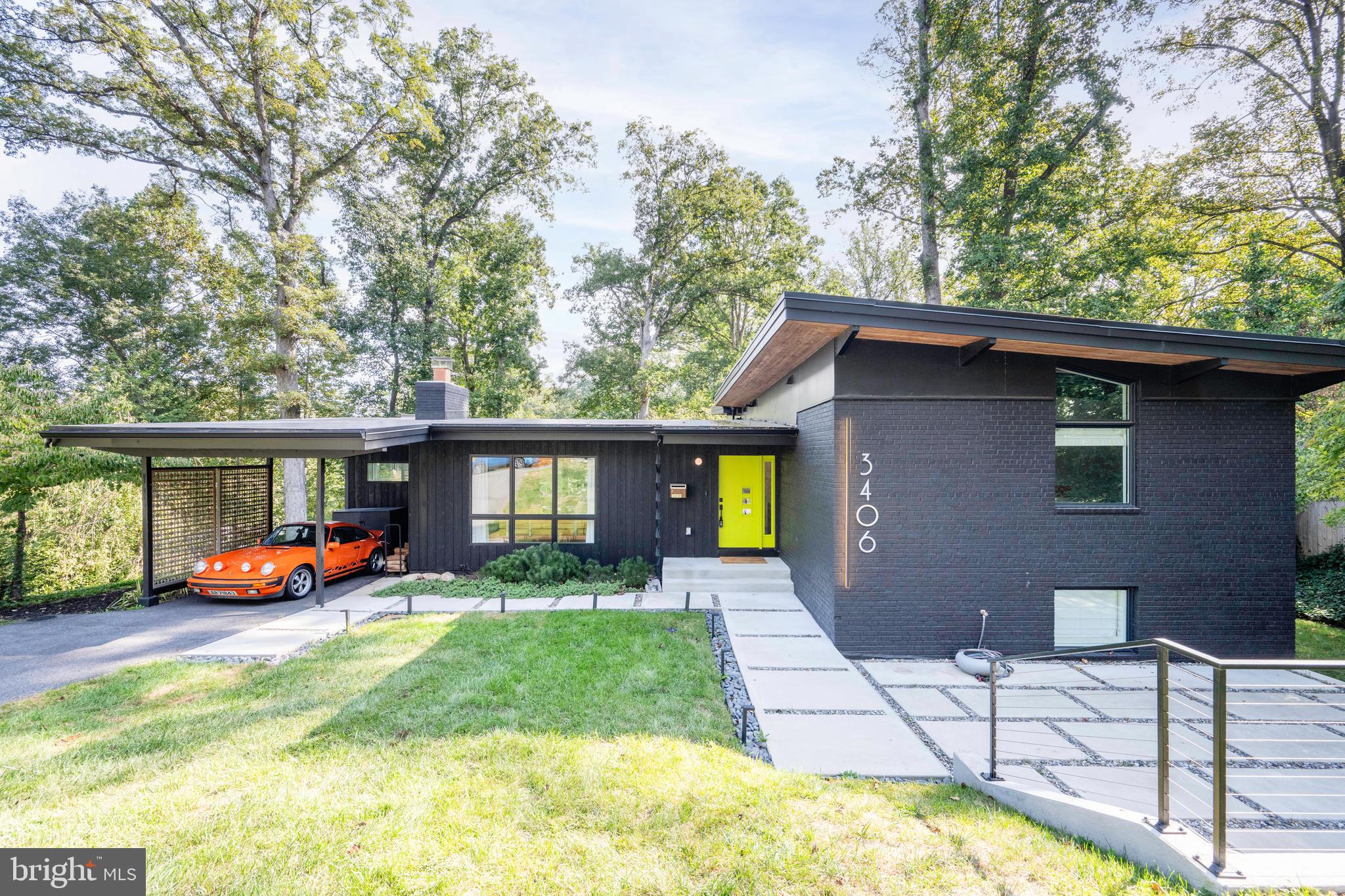 Mid-Century Modern Enthusiasts - Stunning one-of-a-kind mid-century modern home beautifully redesigned and expanded by MM Design Co in 2021.  4 Bedrooms / 4 Full Bathrooms / Spacious .38-Acre Lot. Blending new-construction feel with timeless mid-century modern design and high-end finishes. The home was taken down to the studs in 2021 before being added on to and completely redesigned. 
Main level open living and dining area with vaulted ceilings, exposed beams, stone wood-burning fireplace, oak hardwoods, an all-season skylit den, and a private covered deck. The centerpiece kitchen includes custom two-tone cabinetry, white quartz countertops, an 8.5 ft island, wraparound pantry, and black stainless appliances.
Upstairs, find 3 bedrooms and 3 baths. Primary Suite features soaring ceilings, floor-to-ceiling windows, dual walk-in closets with Elfa custom closets, private laundry, and a spa bath with rain shower, freestanding tub, and custom walnut double vanity.
The lower level offers a light-filled rec room with wet bar, a bedroom with large walk in shower full bath, home office with built-ins, second laundry, and walkout access to the backyard. Outside, enjoy a modern concrete front patio, striking mid-century rooflines, tongue-and-groove wood soffits, Hardi-panel siding + Nakamoto Frestry Shou Sugi Ban siding, and black-framed Andersen windows.
Nearly everything was new from the 2021 addition and total remodel, including membrane roof, insulation, Anderson 400 series windows, HVAC, plumbing, main sewer line, electrical, drywall, designer fixtures, driveway, landscaping, and more.