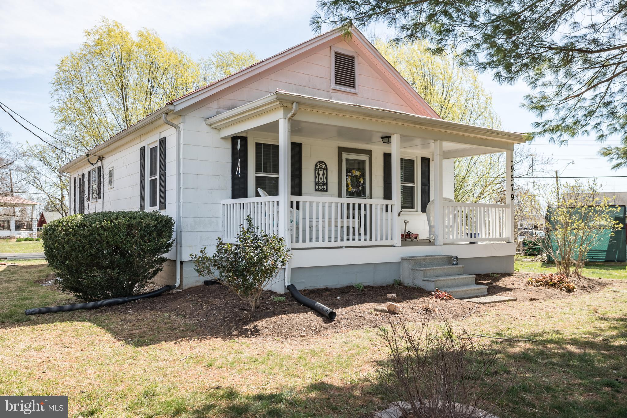 **Embrace the Tranquility of Country Living!**
Imagine unwinding on your charming front porch, savoring breathtaking sunset views with your favorite after-dinner drink in hand. This delightful bungalow presents the perfect opportunity for country living while still being conveniently located less than 20 minutes from Manassas Airport VRE, shopping, and dining.
Inside, you’ll find hardwood floors that add warmth and character. living room, two generously sized bedrooms and a spacious, beautifully renovated bath. The contemporary kitchen is a cook's dream, fully updated to accommodate your culinary adventures. Off kitchen you will find the laundry room and pantry. 
Recent upgrades include a newer HVAC system 2 ton 16 seer(installed December 2019) and energy-efficient newer windows that illuminate the inviting interior. The porch boasts a durable, low-maintenance floor with newly replaced joists (2021), ensuring you can relax without worry.
For your peace of mind, the cellar has been professionally waterproofed, providing additional storage and utility. Plus, with the dryer and hot water heater replaced in 2024, you can move in with confidence, knowing that everything has been thoughtfully maintained.
Don’t miss your chance to own this enchanting retreat—make it yours today!